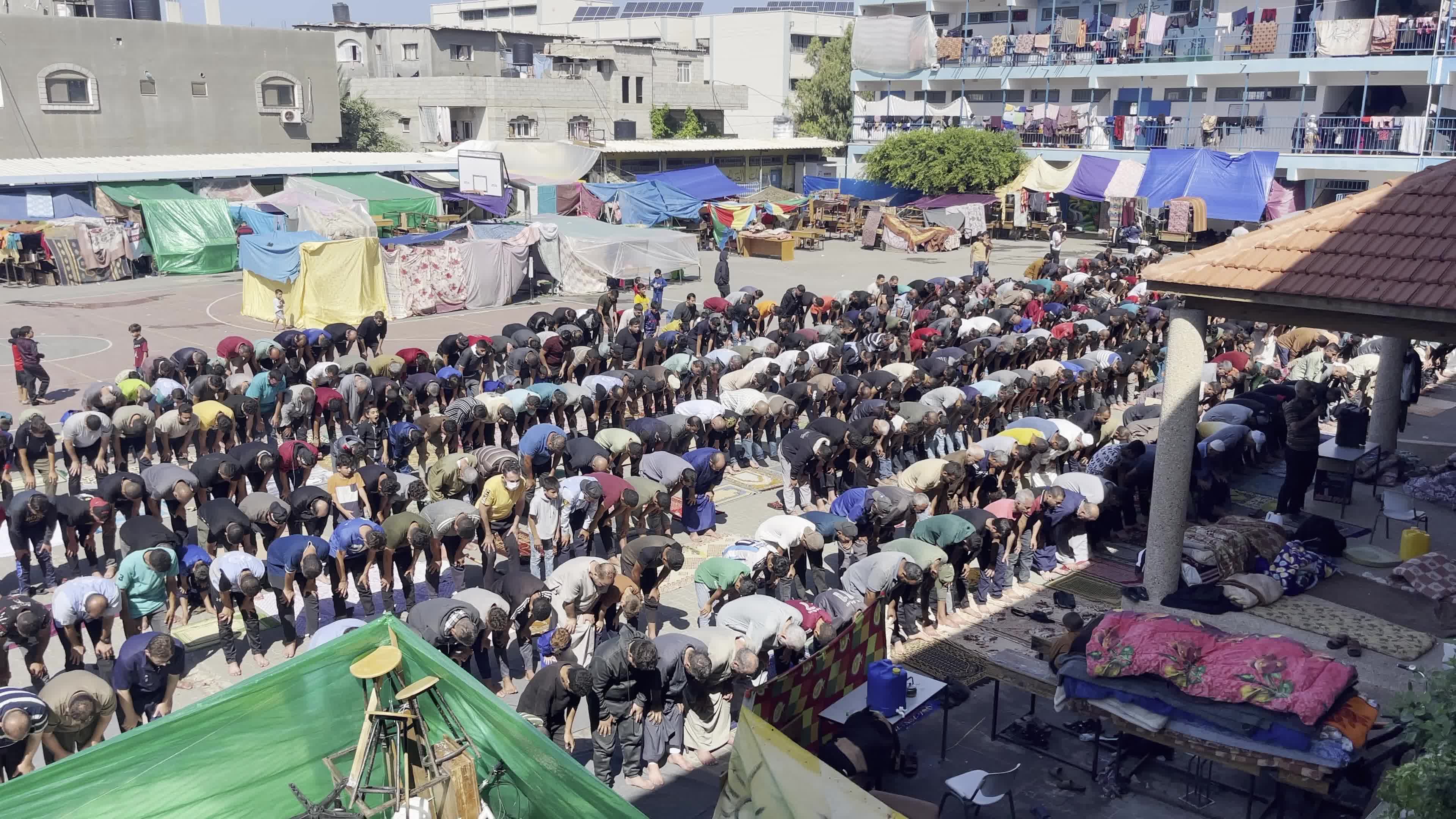 Displaced Palestinians Pray at UNRWA School in Khan Yunis Amid Conflict Between Hamas and Israel