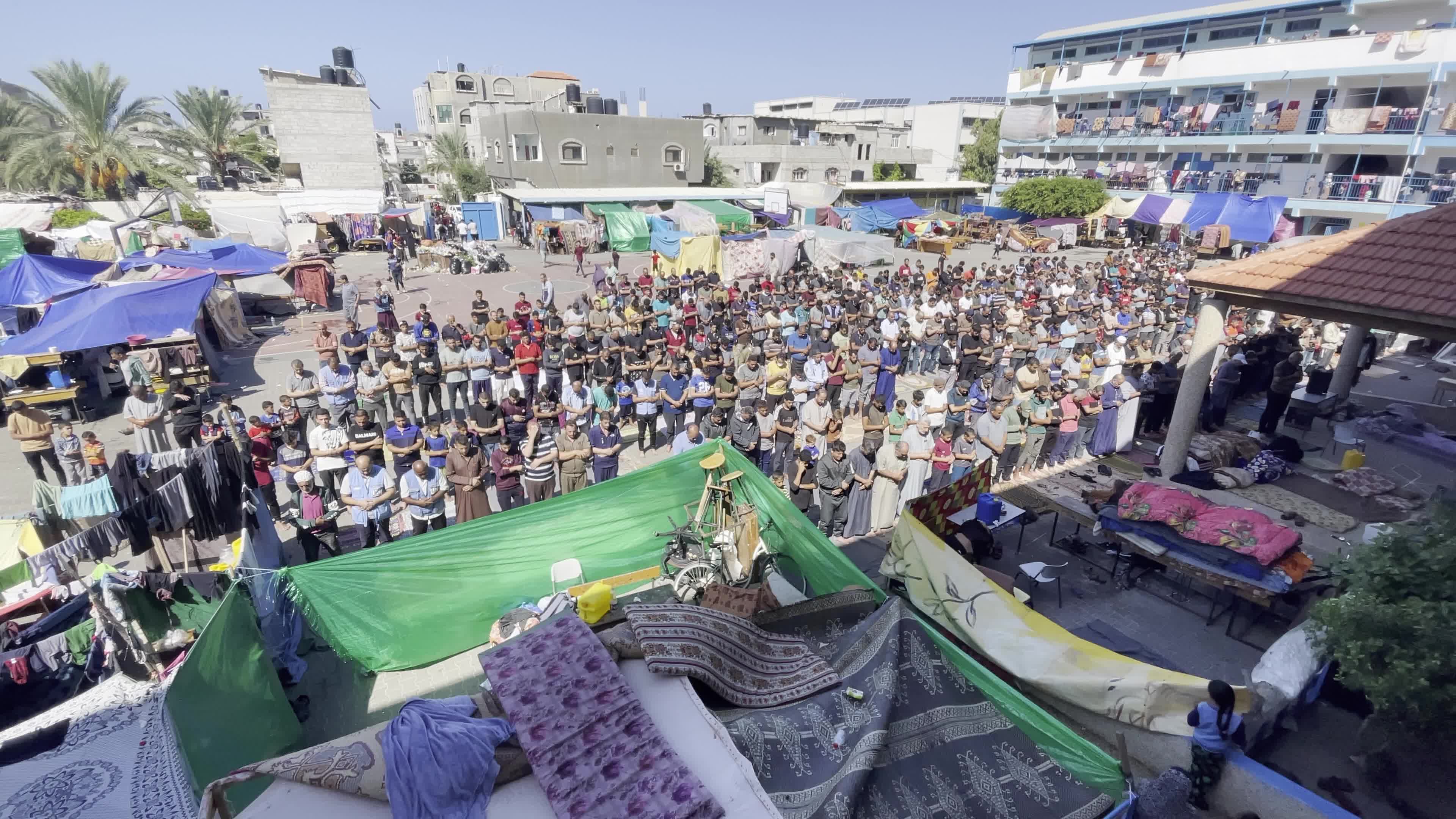 Displaced Palestinians Pray at UNRWA School in Khan Yunis Amid Conflict Between Hamas and Israel
