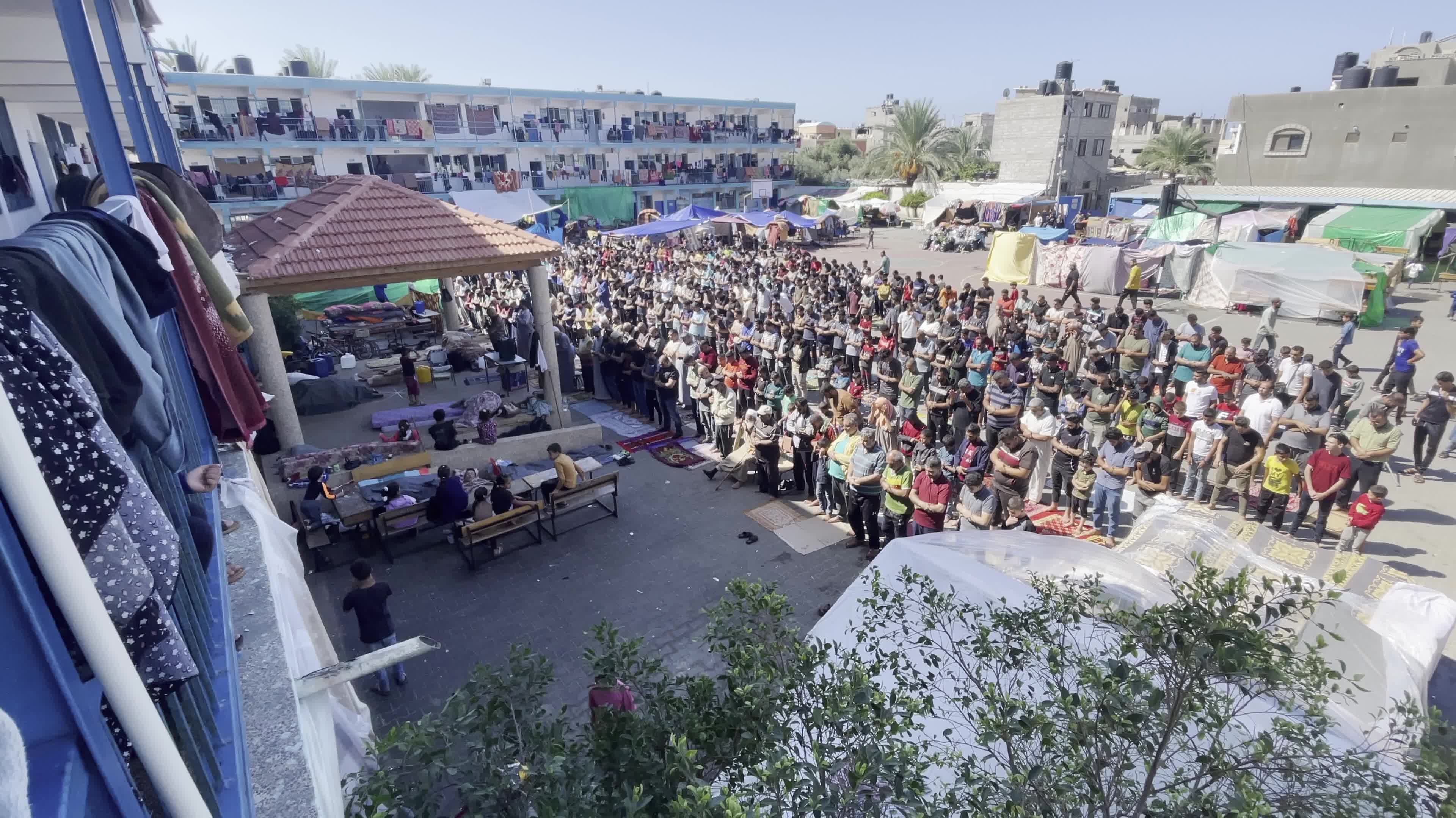 Displaced Palestinians Pray at UNRWA School in Khan Yunis Amid Conflict Between Hamas and Israel