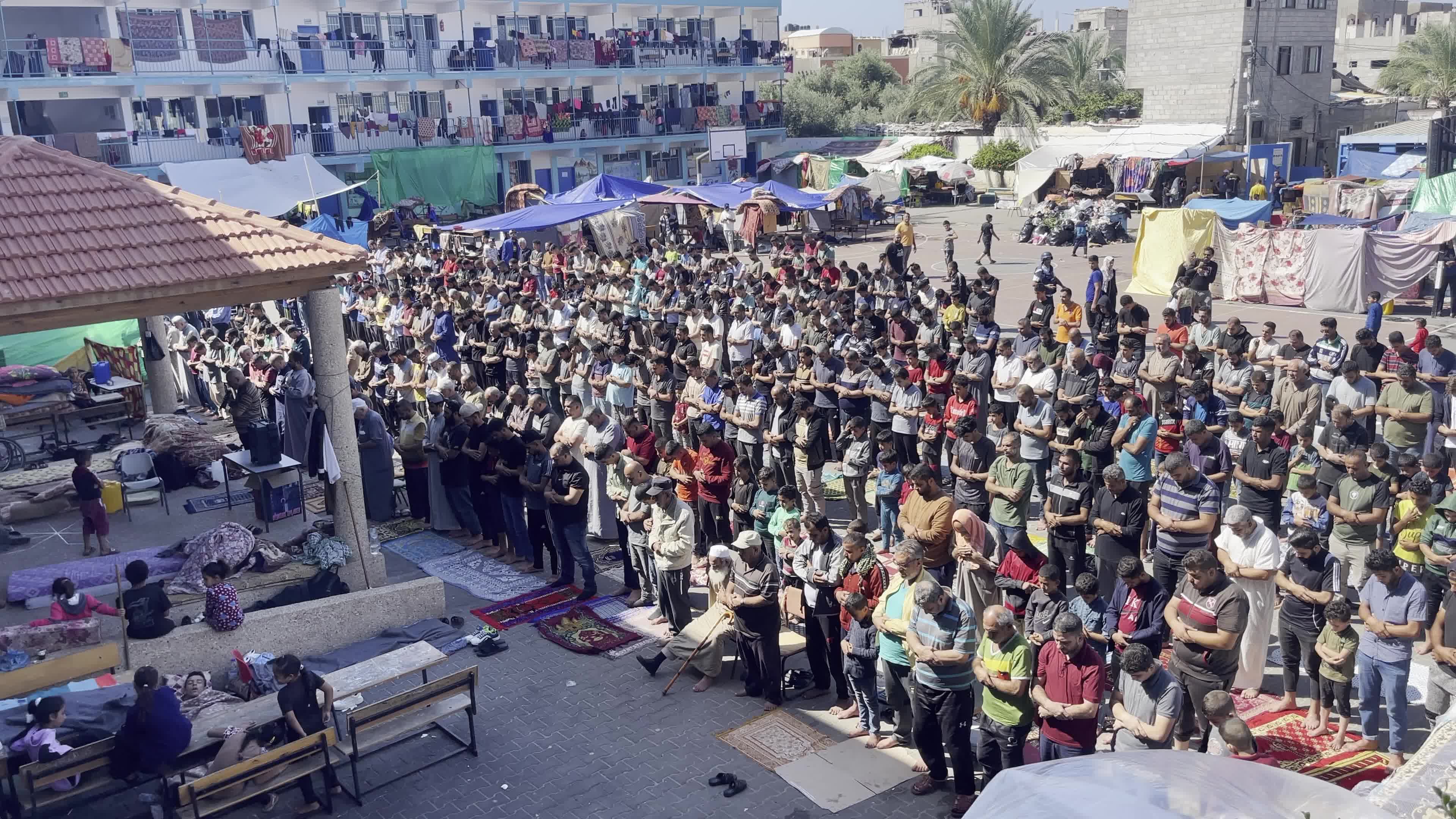 Displaced Palestinians Pray at UNRWA School in Khan Yunis Amid Conflict Between Hamas and Israel