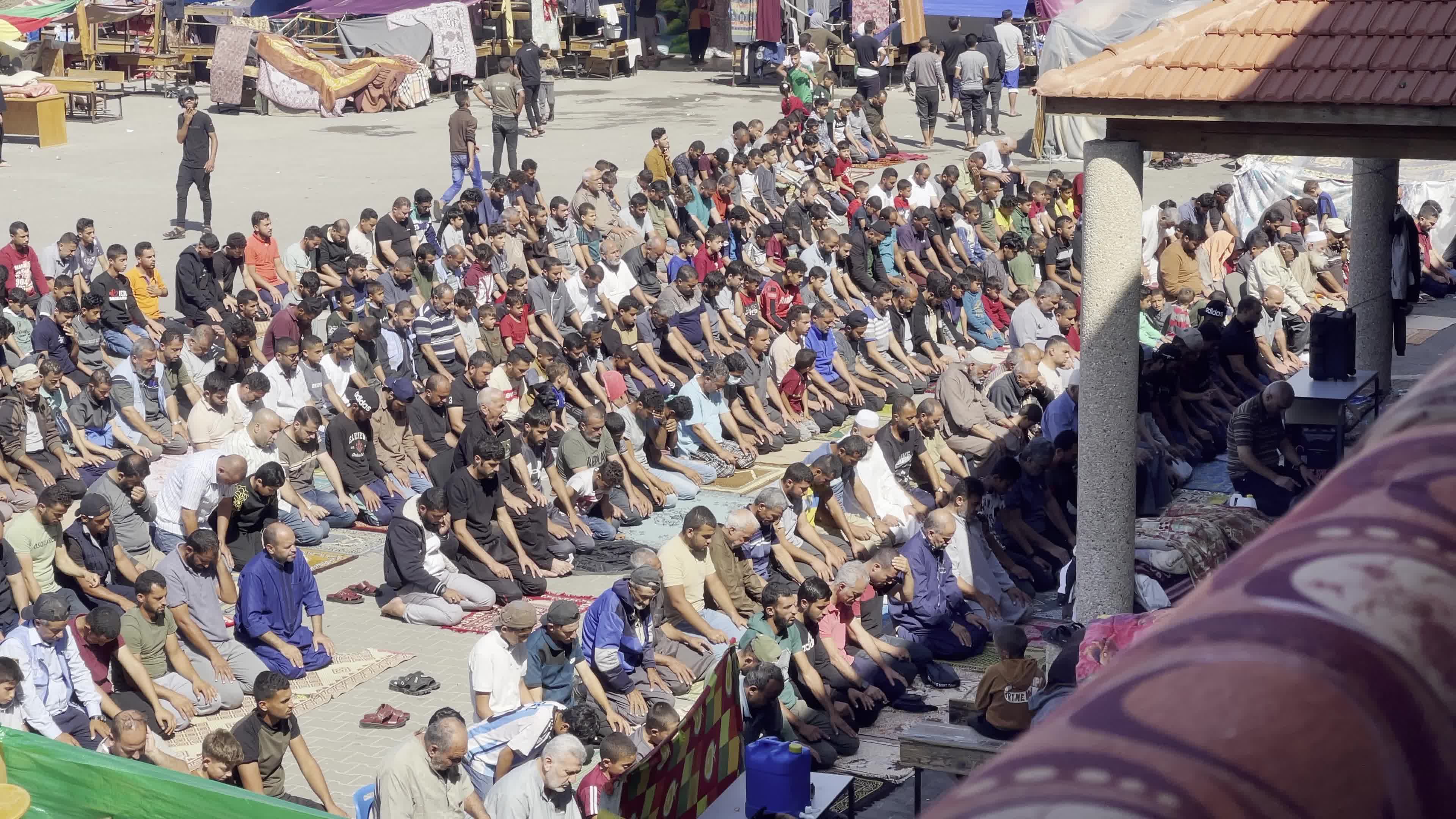 Displaced Palestinians Pray at UNRWA School in Khan Yunis Amid Conflict Between Hamas and Israel