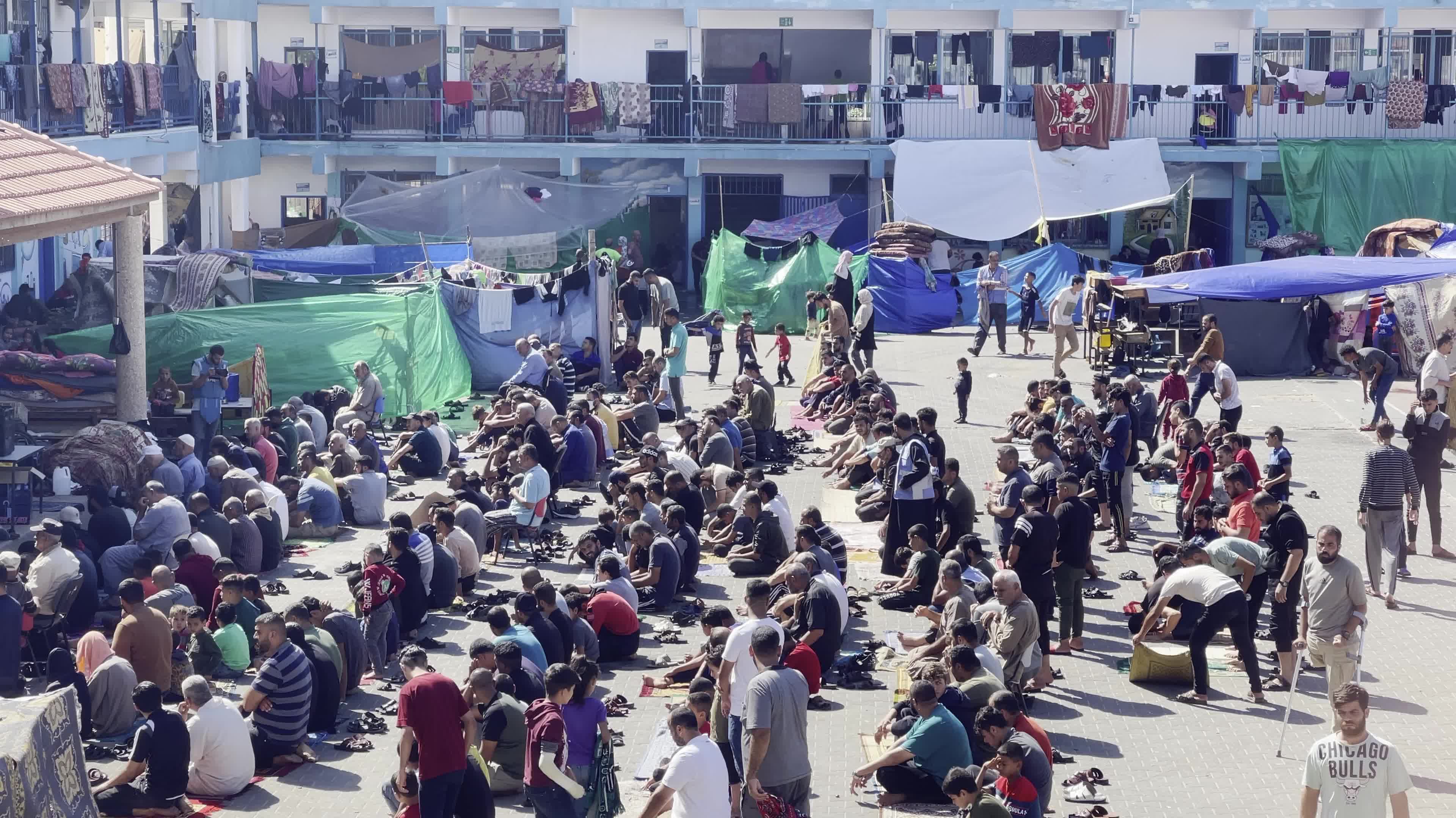 Displaced Palestinians Pray at UNRWA School in Khan Yunis Amid Conflict Between Hamas and Israel