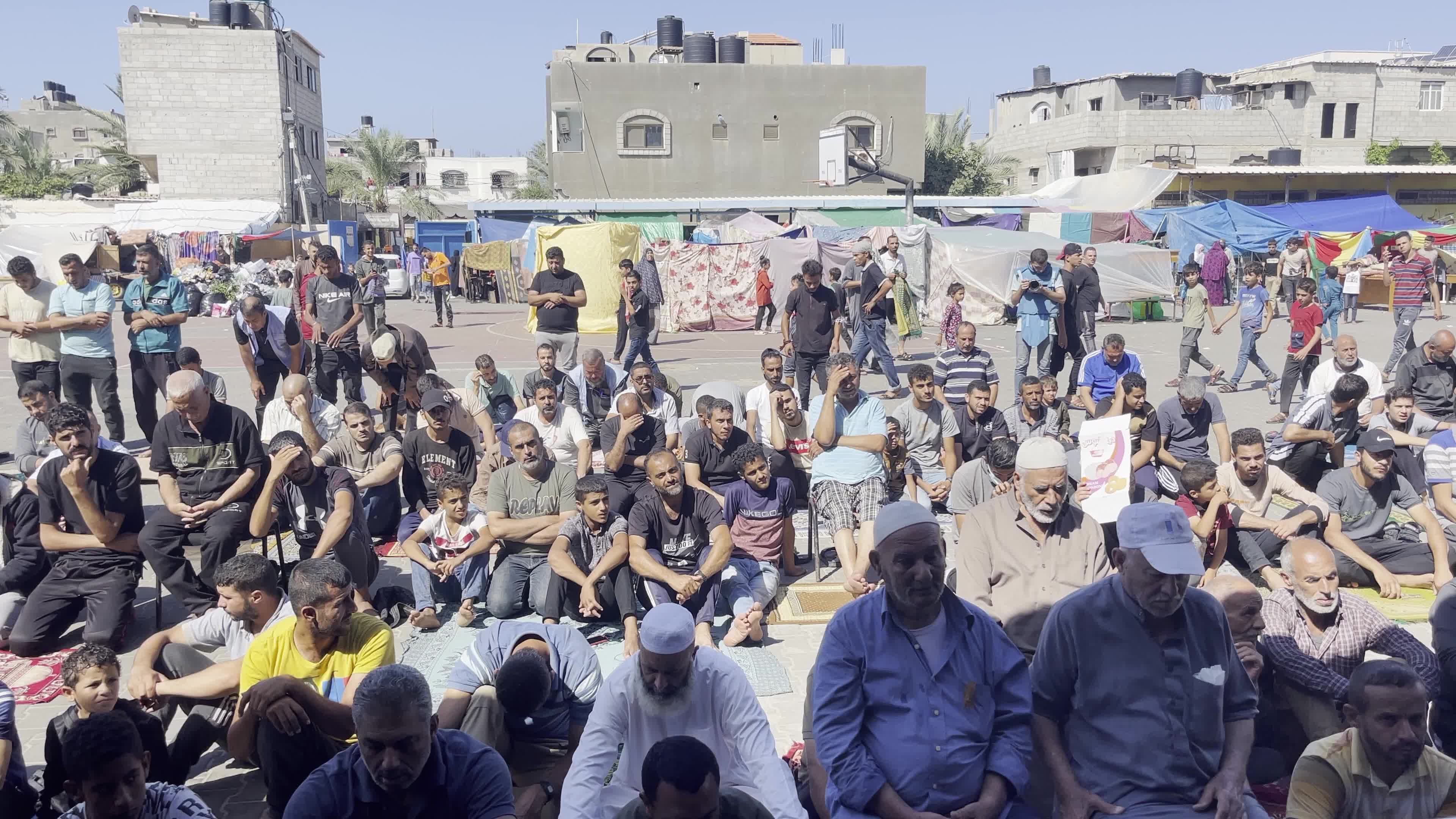 Displaced Palestinians Pray at UNRWA School in Khan Yunis Amid Conflict Between Hamas and Israel