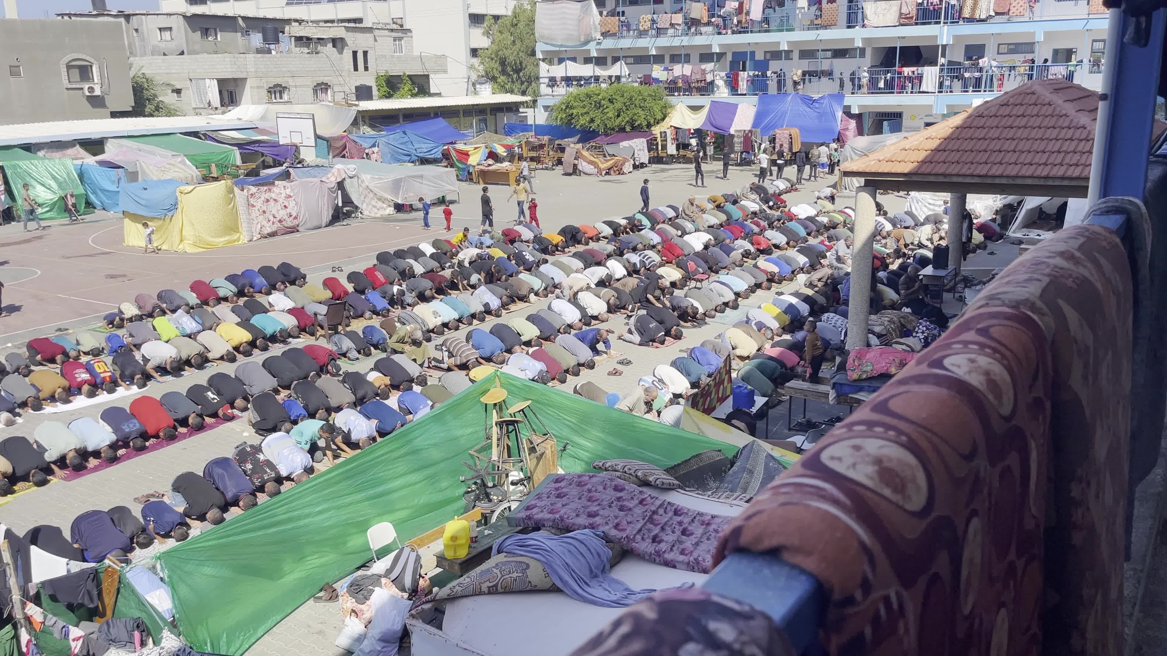 Displaced Palestinians Pray at UNRWA School in Khan Yunis Amid Conflict Between Hamas and Israel
