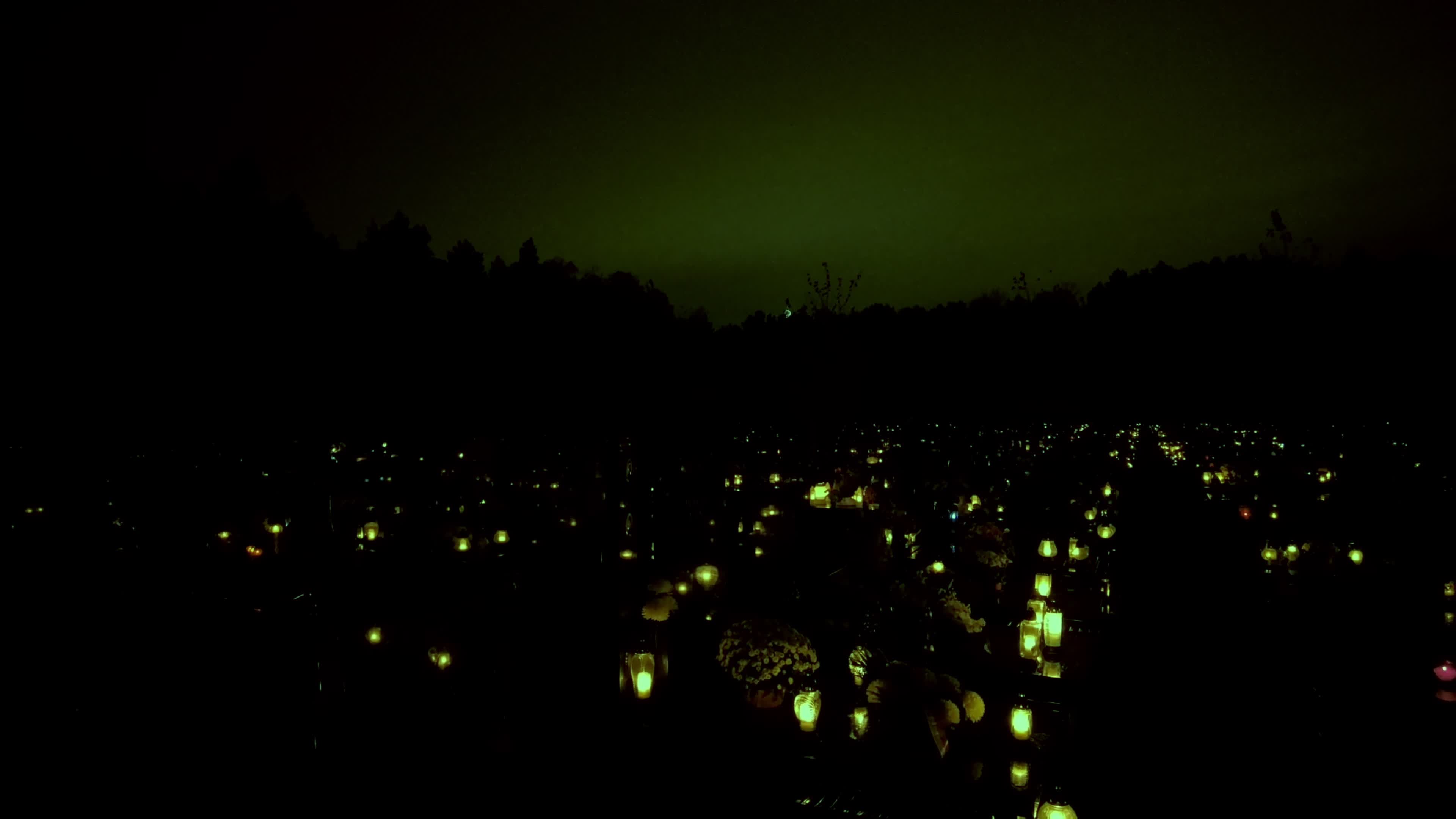 All Saints Day cemetery at night 