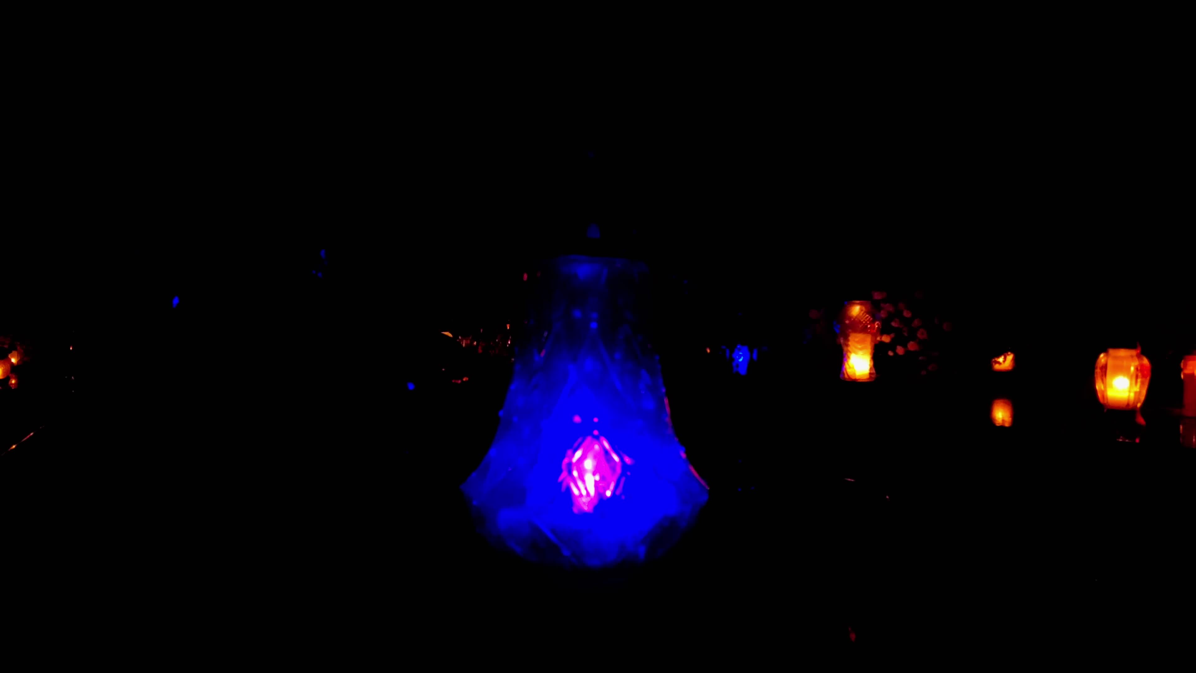 All Saints Day cemetery at night 