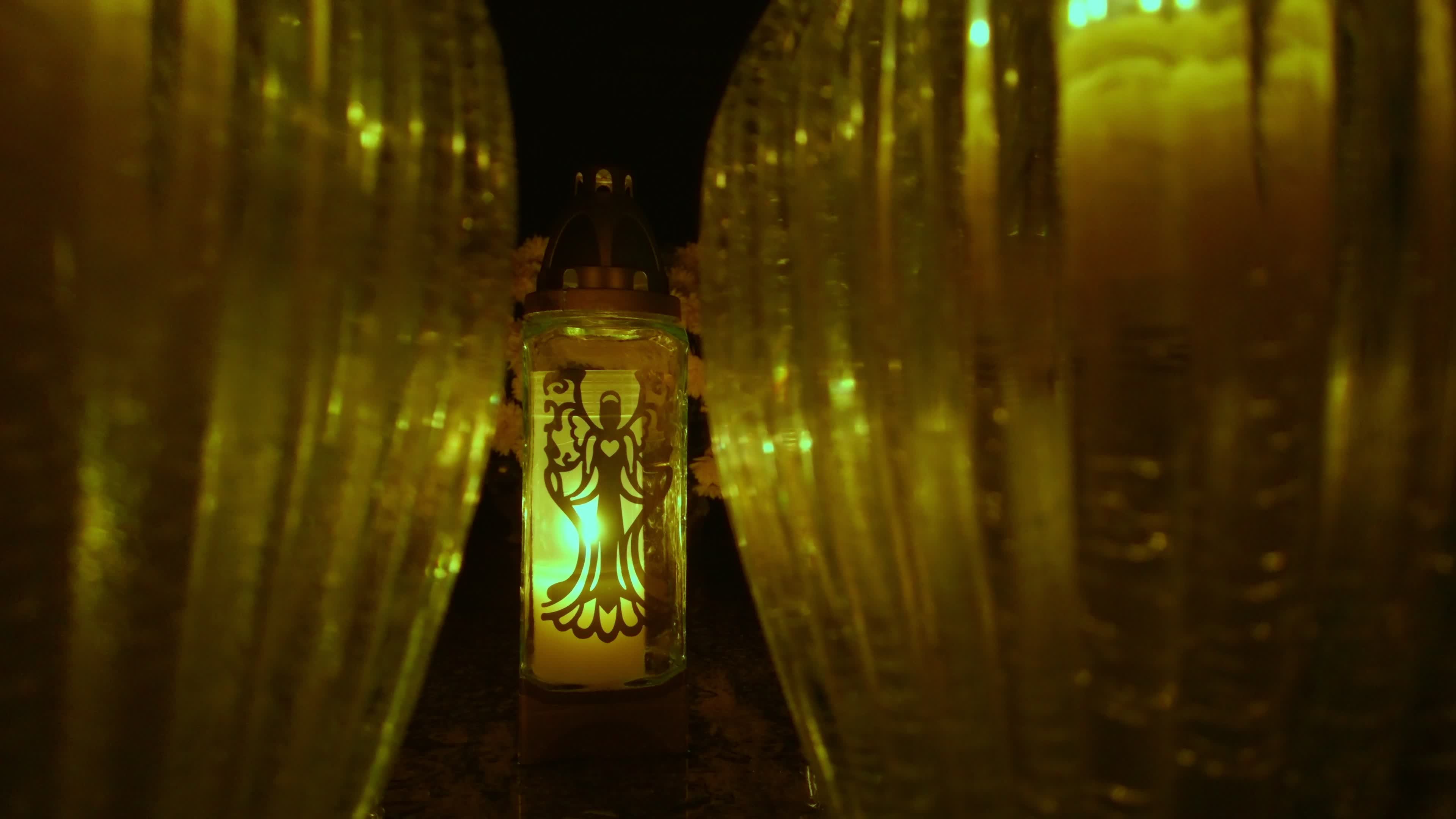 All Saints Day cemetery at night 