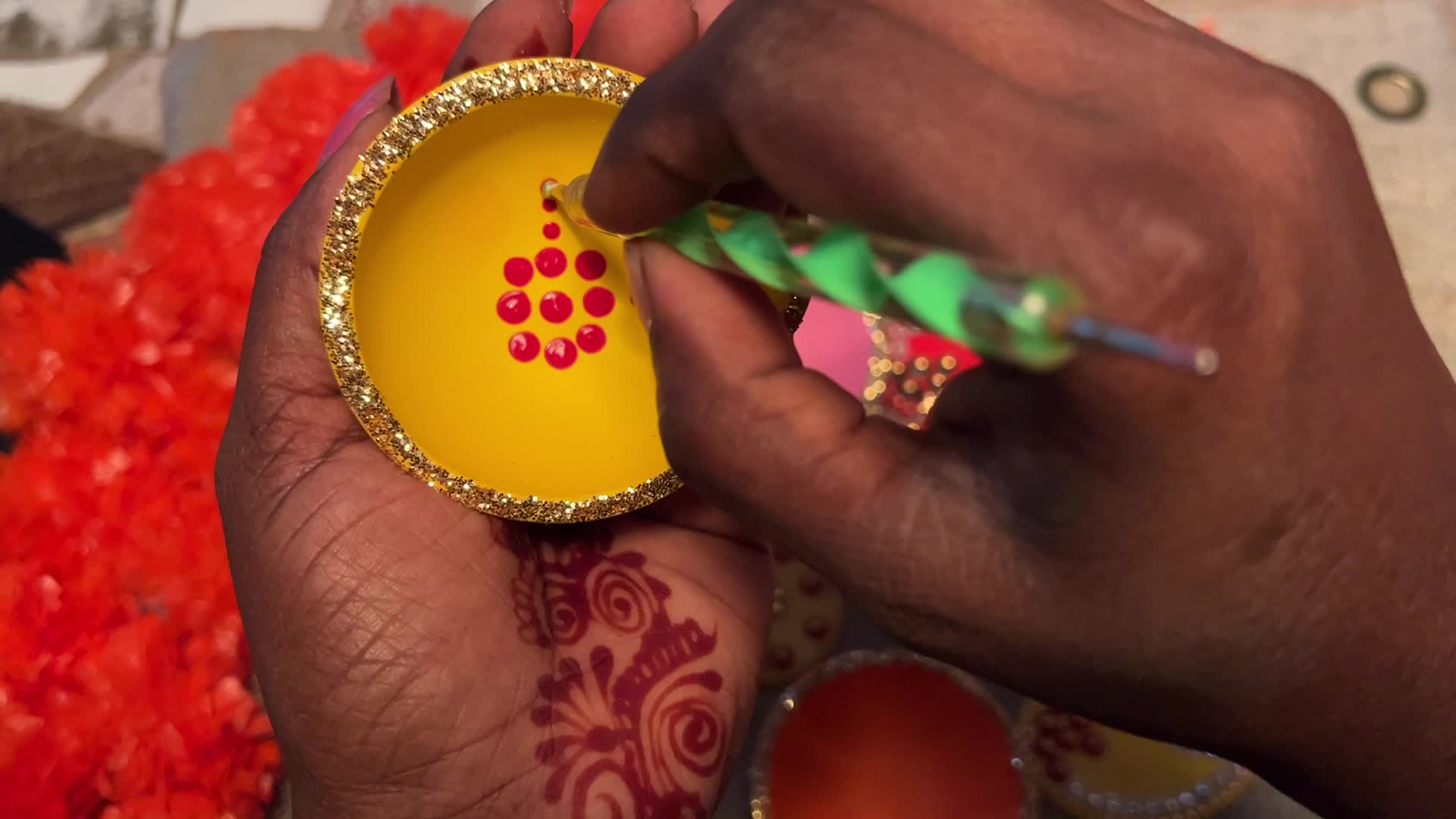 Decorating clay Diwali diyas in preparation for the Diwali festival