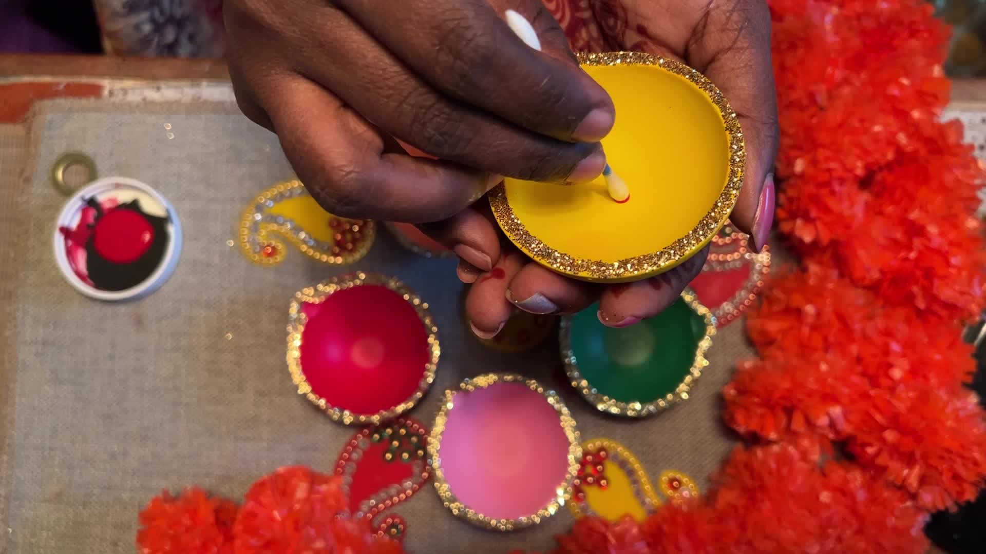 Decorating clay Diwali diyas in preparation for the Diwali festival