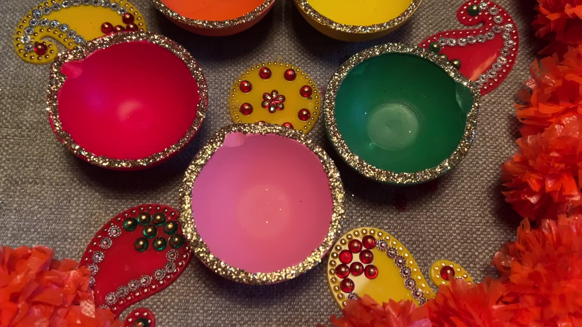 Decorating clay Diwali diyas in preparation for the Diwali festival