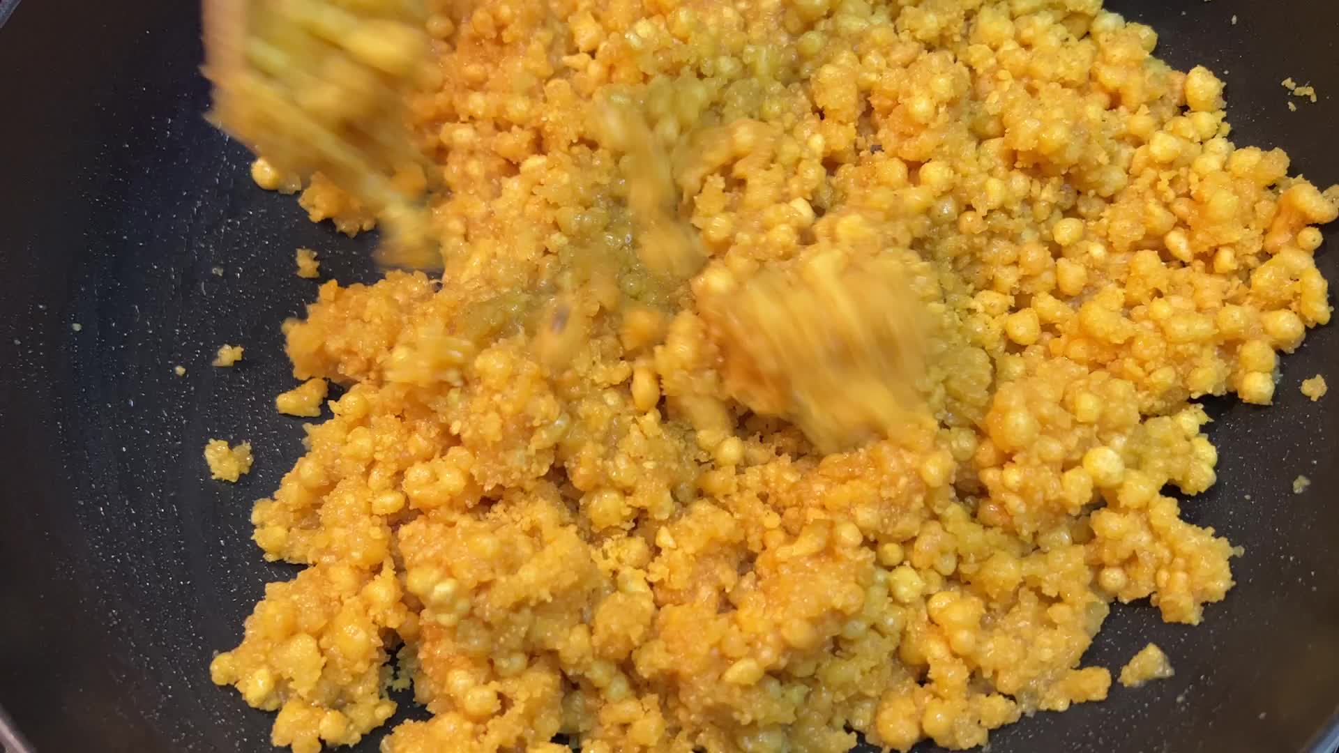 Woman preparing Boondi Laddus for the festival of Diwali