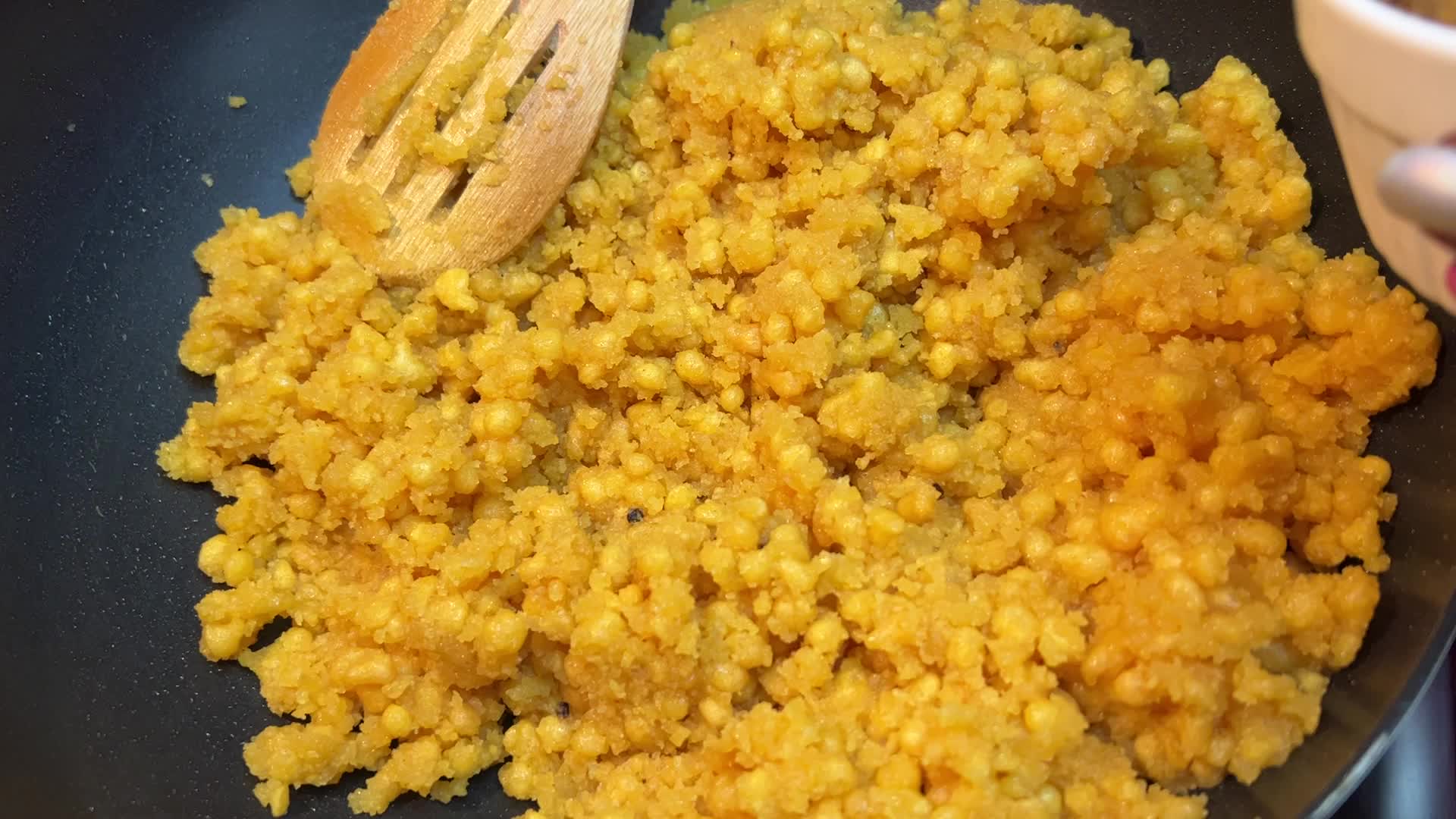 Woman preparing Boondi Laddus for the festival of Diwali