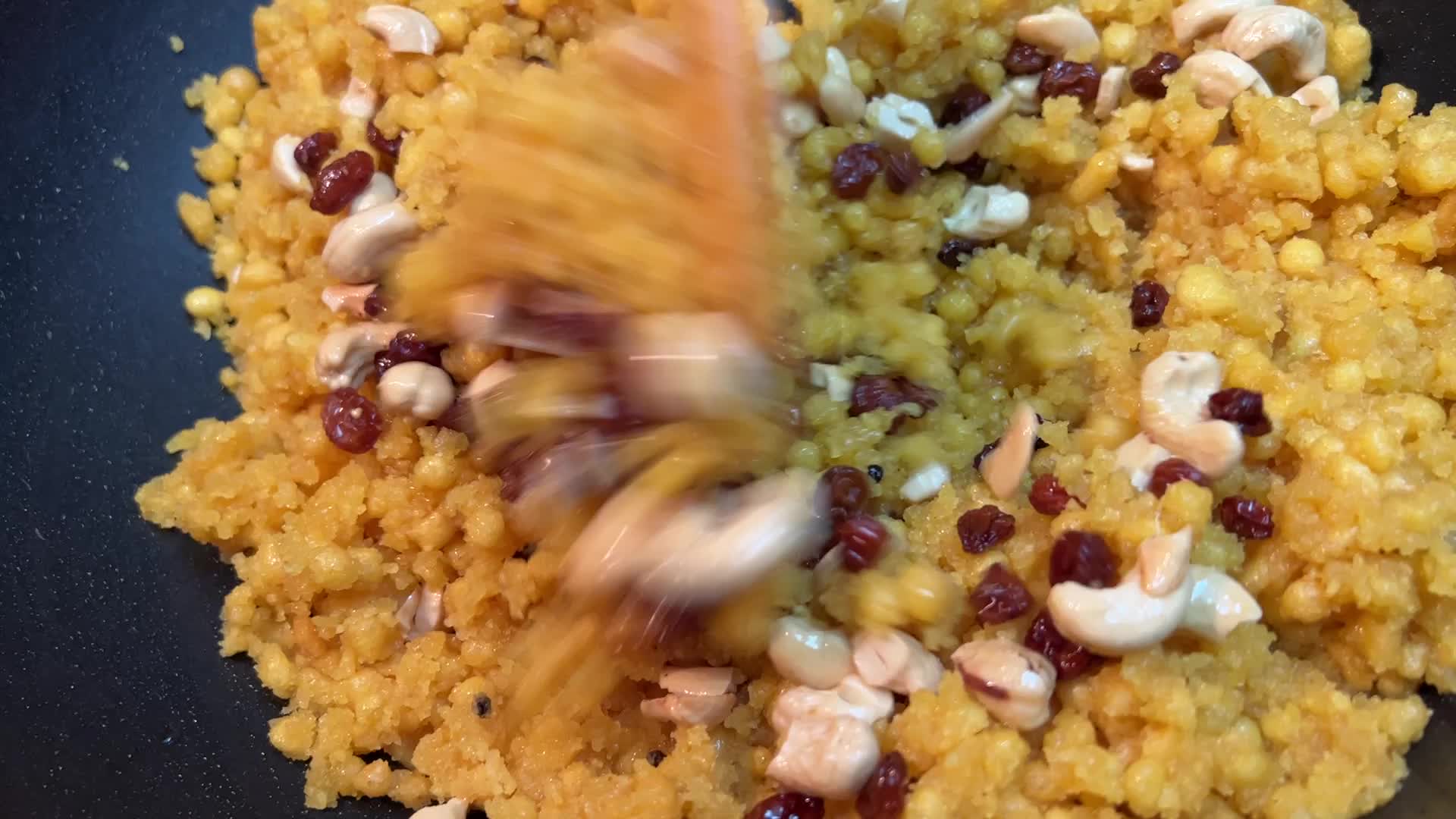 Woman preparing Boondi Laddus for the festival of Diwali