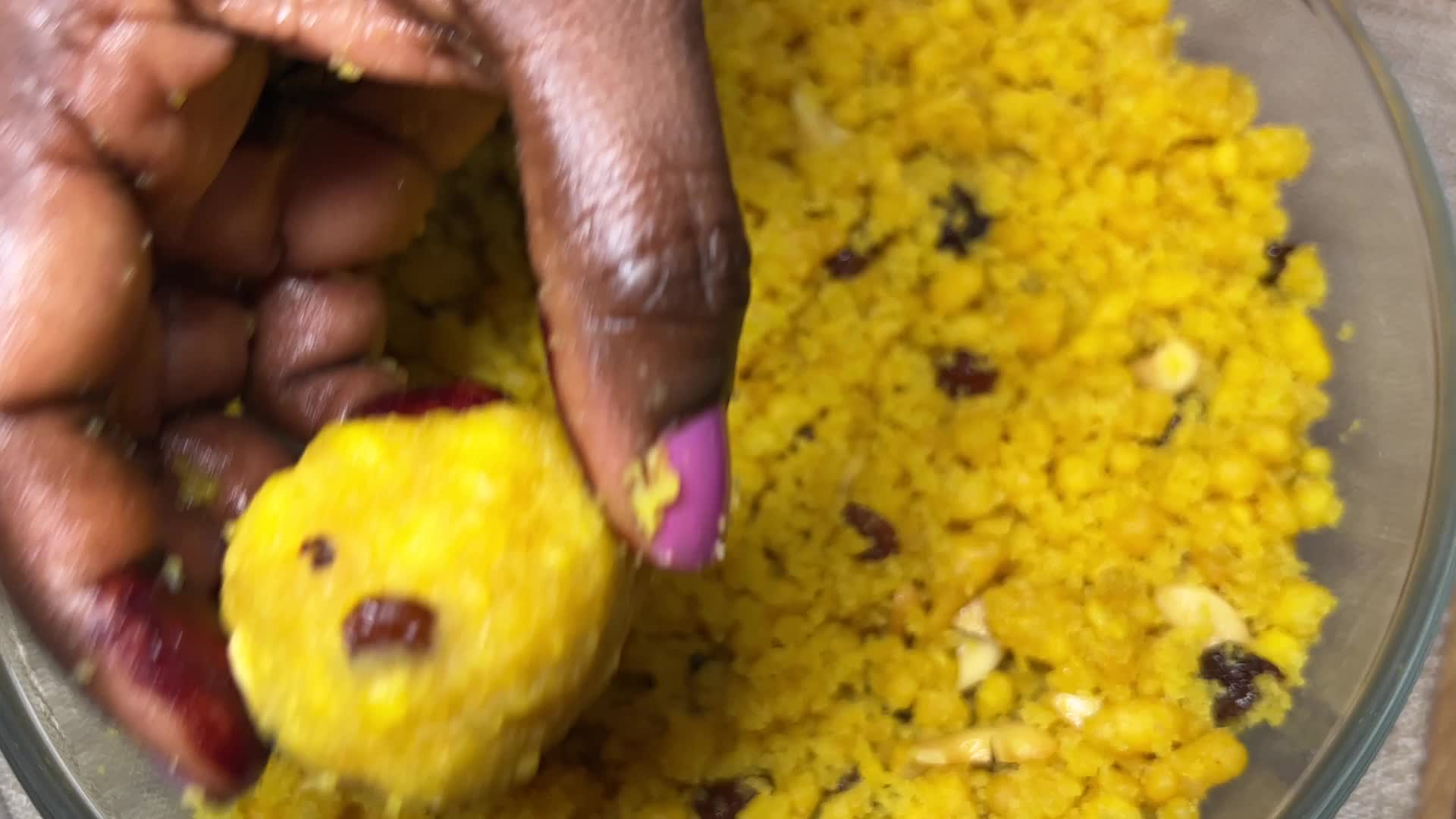 Woman preparing Boondi Laddus for the festival of Diwali