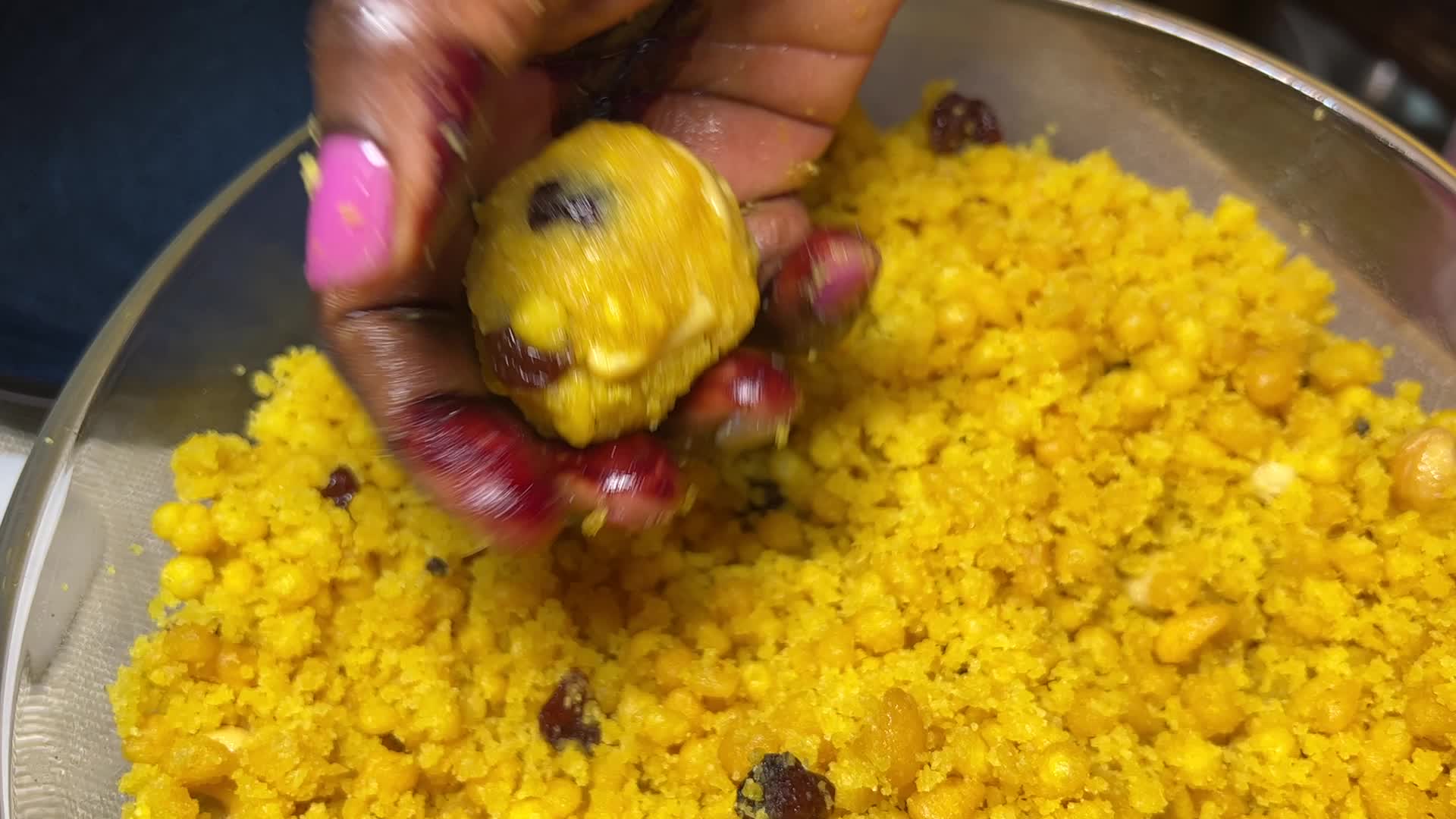 Woman preparing Boondi Laddus for the festival of Diwali