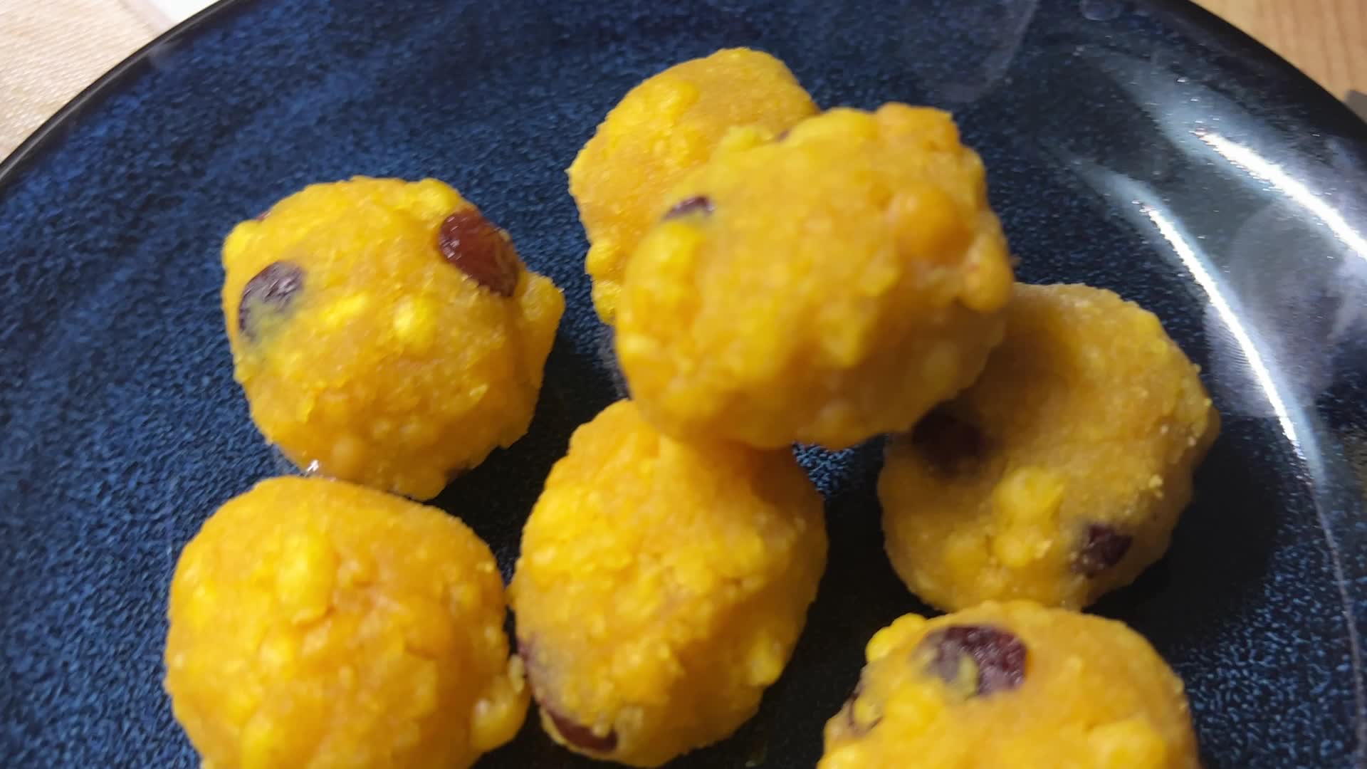 Woman preparing Boondi Laddus for the festival of Diwali