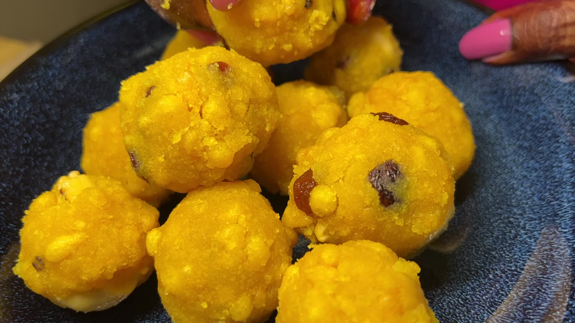 Woman preparing Boondi Laddus for the festival of Diwali