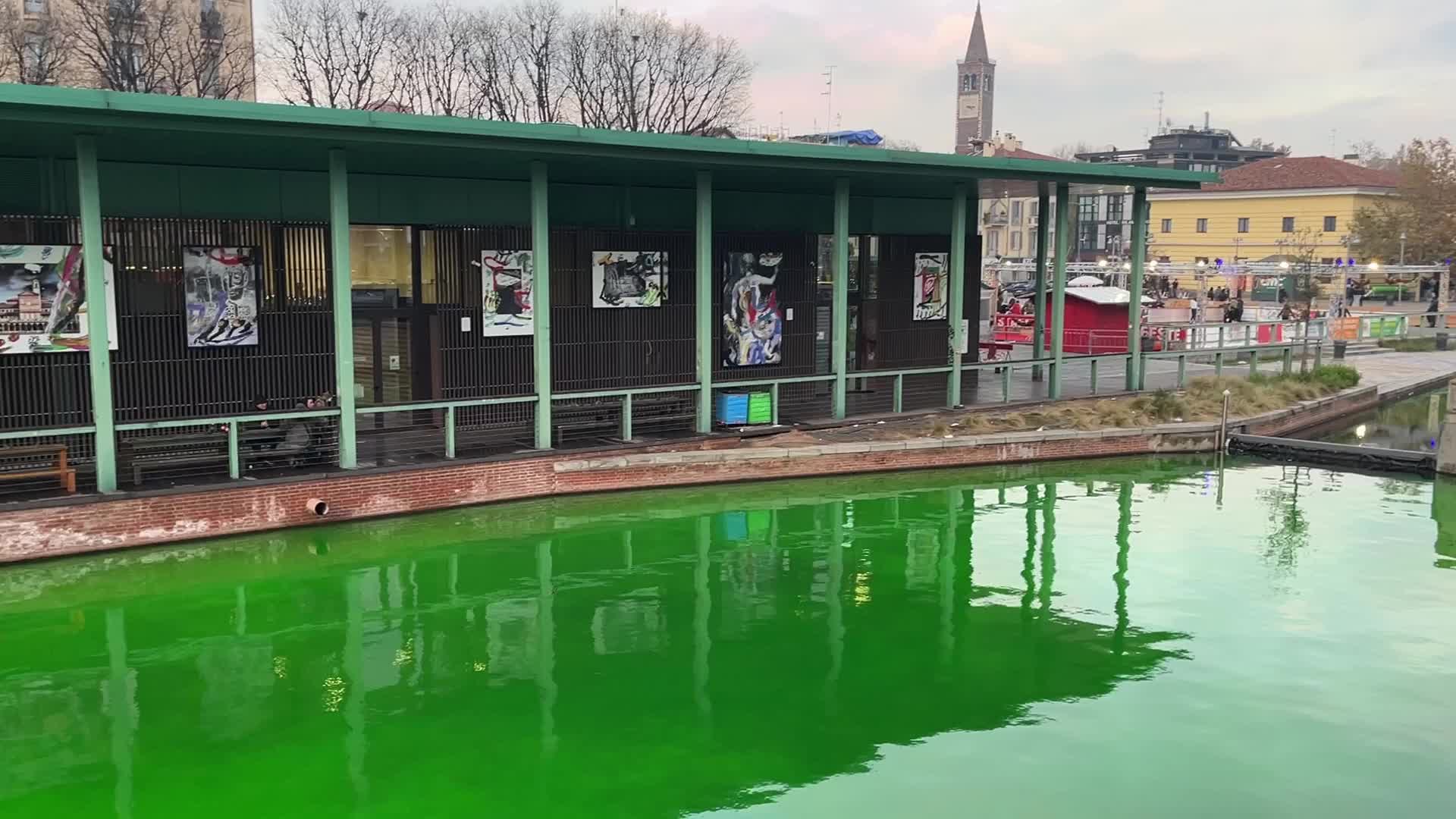 The water of the Darsena colored green by the activists of Extinction Rebellion in Milan