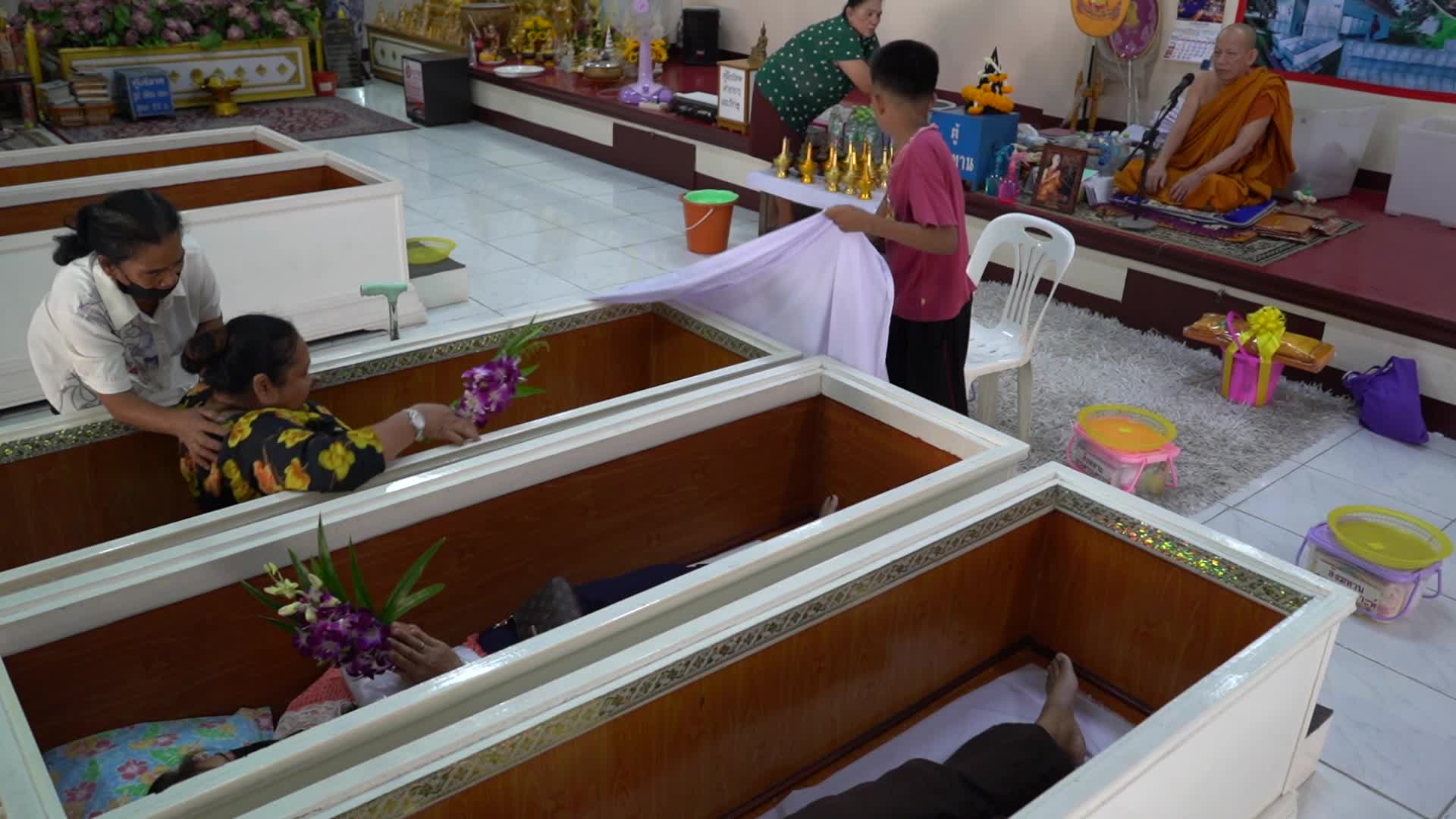 Thai People Lie In Coffins To Welcome The New Year.