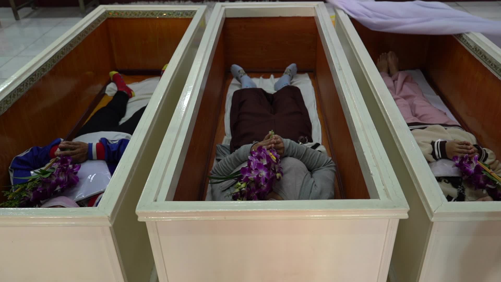Thai People Lie In Coffins To Welcome The New Year.