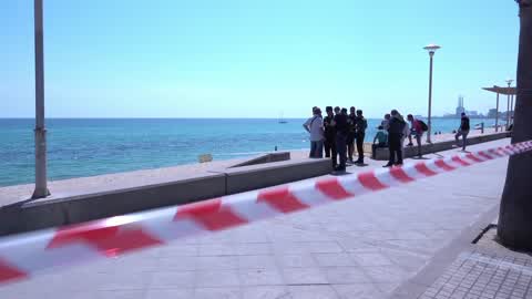 The Spanish Navy investigates possible explosive device on a beach in Barcelona