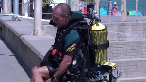 The Spanish Navy investigates possible explosive device on a beach in Barcelona