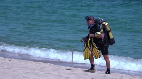 The Spanish Navy investigates possible explosive device on a beach in Barcelona
