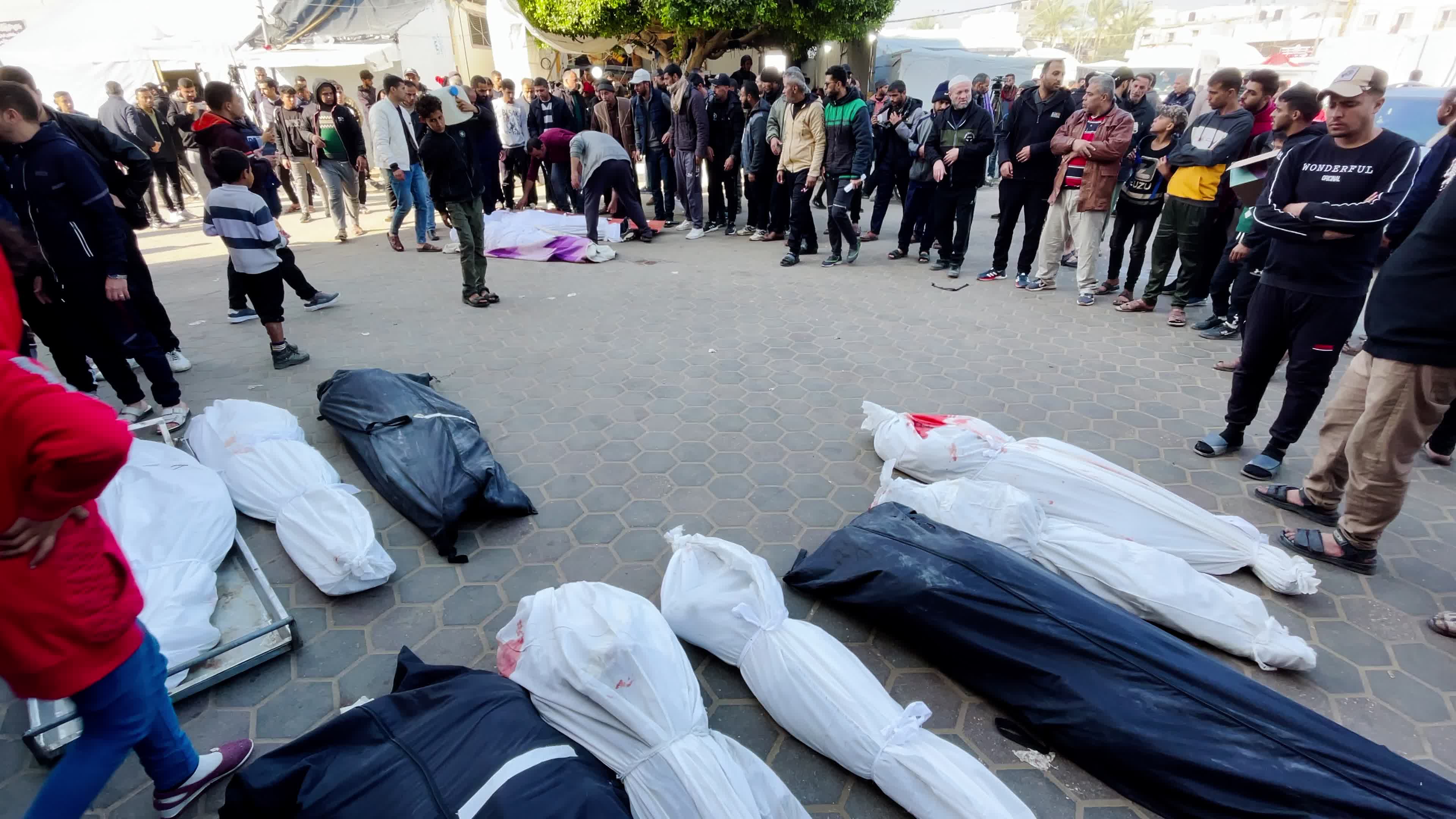 Palestinian Mourners Gather at Al-Aqsa Hospital Following Israeli Airstrike