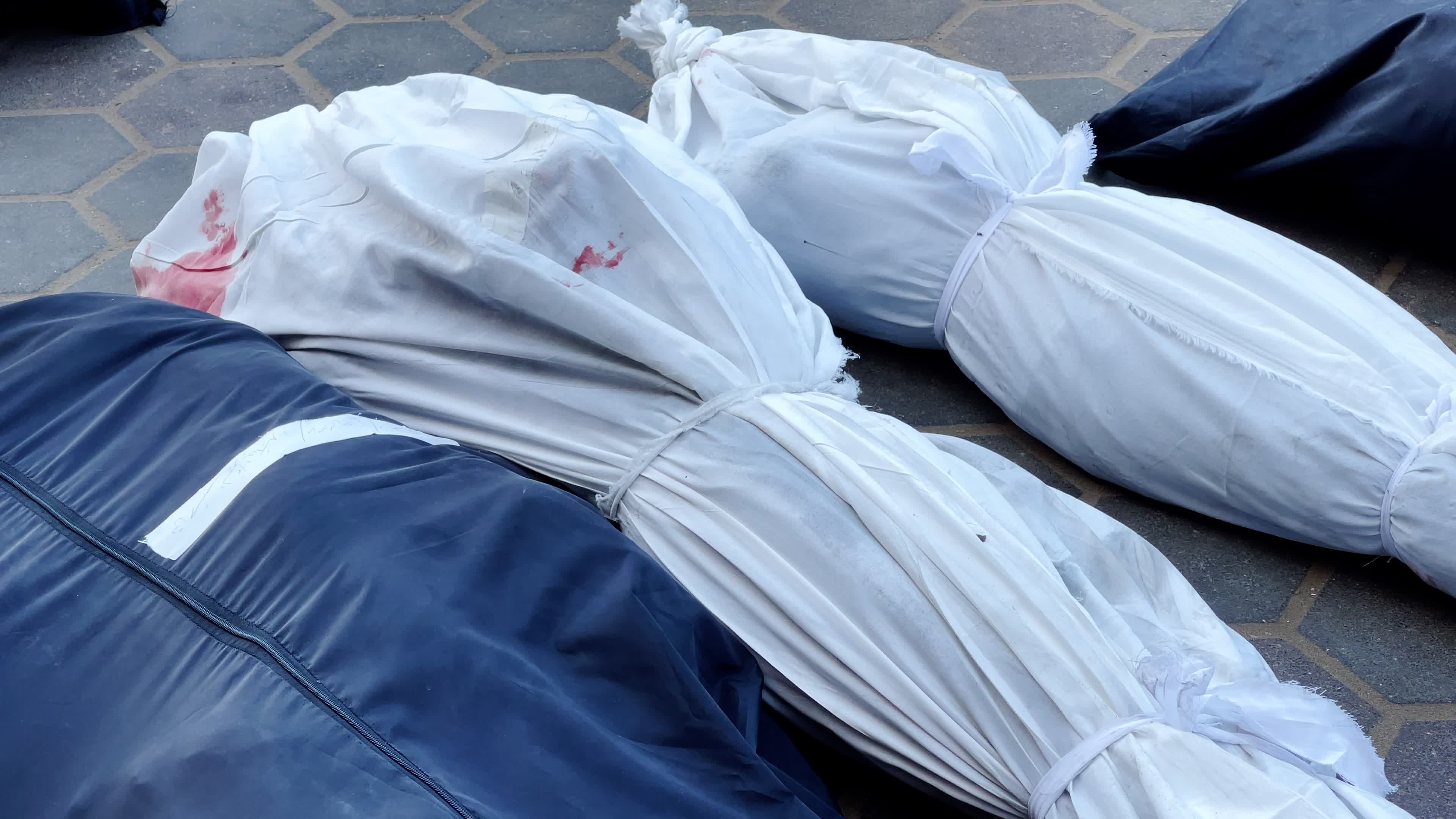 Palestinian Mourners Gather at Al-Aqsa Hospital Following Israeli Airstrike