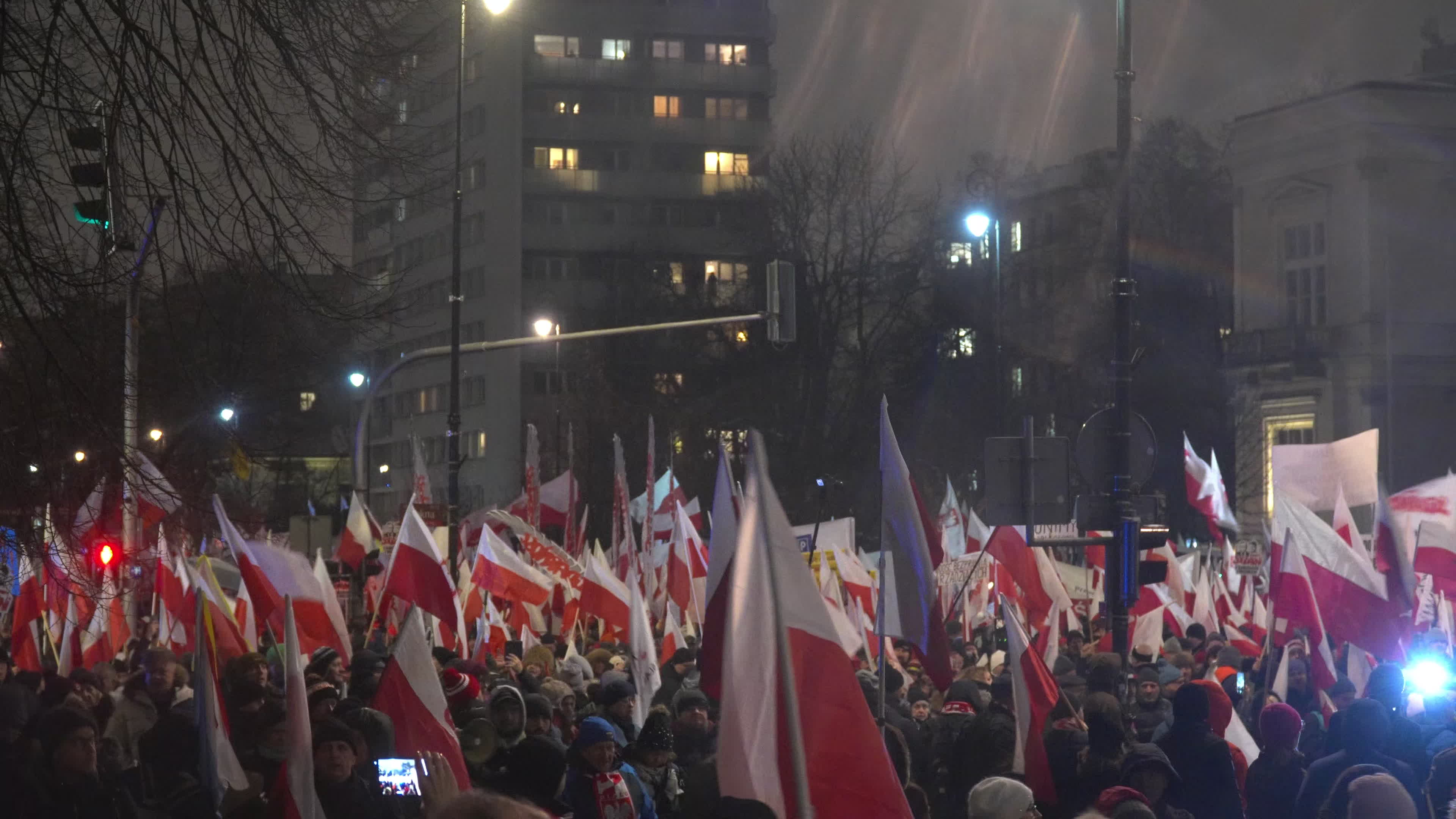 Tens of thousands march in protest of imprisoned politicians in Warsaw