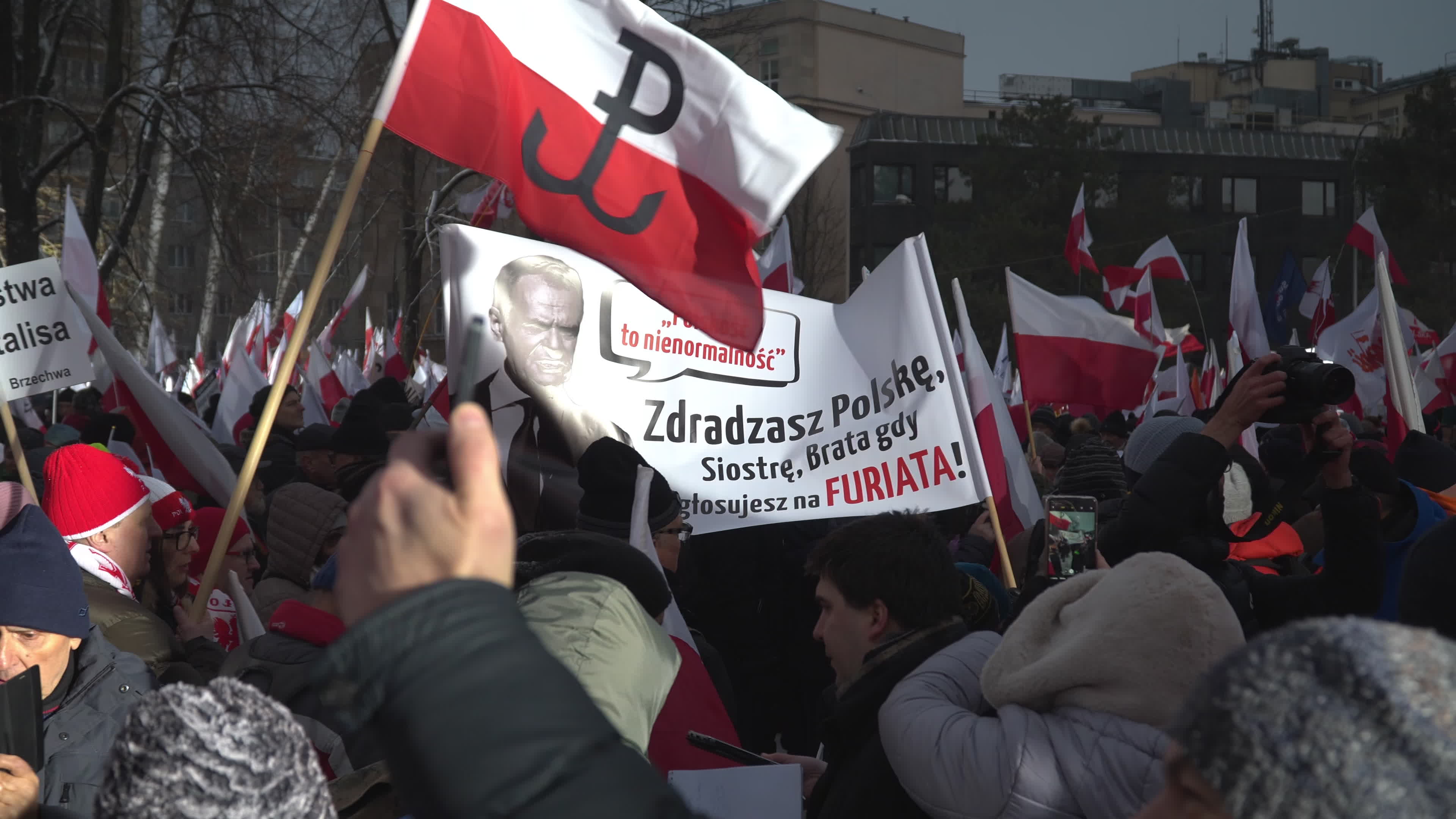 Tens of thousands march in protest of imprisoned politicians in Warsaw