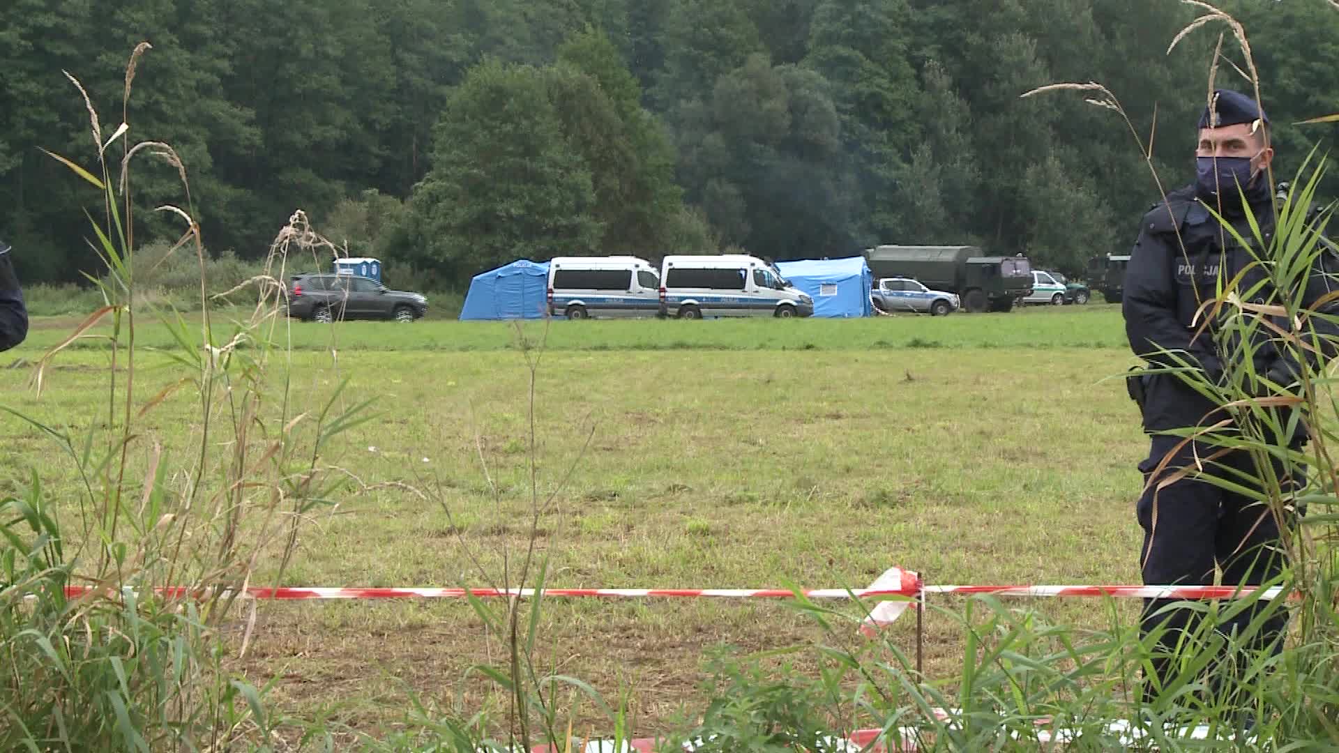 Migrants camp at Polish-Belarusian border guarded by police and military