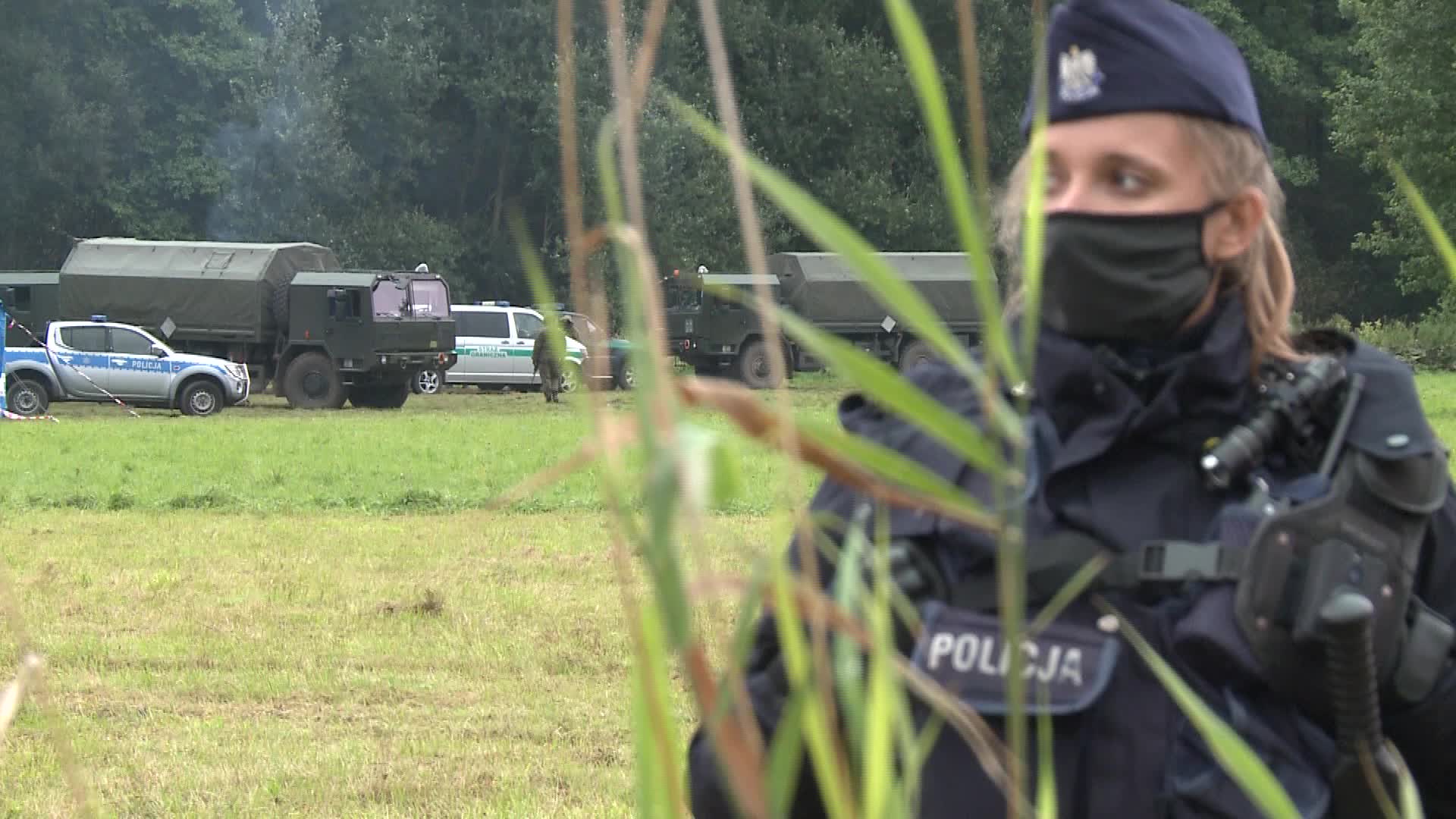 Migrants camp at Polish-Belarusian border guarded by police and military