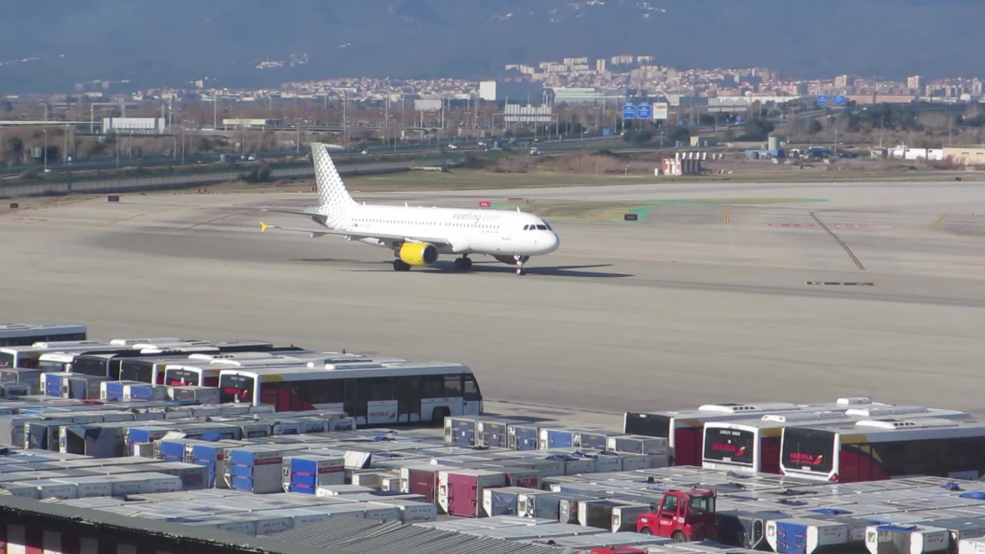 Diverse aircraft on the runway of Barcelona airport
