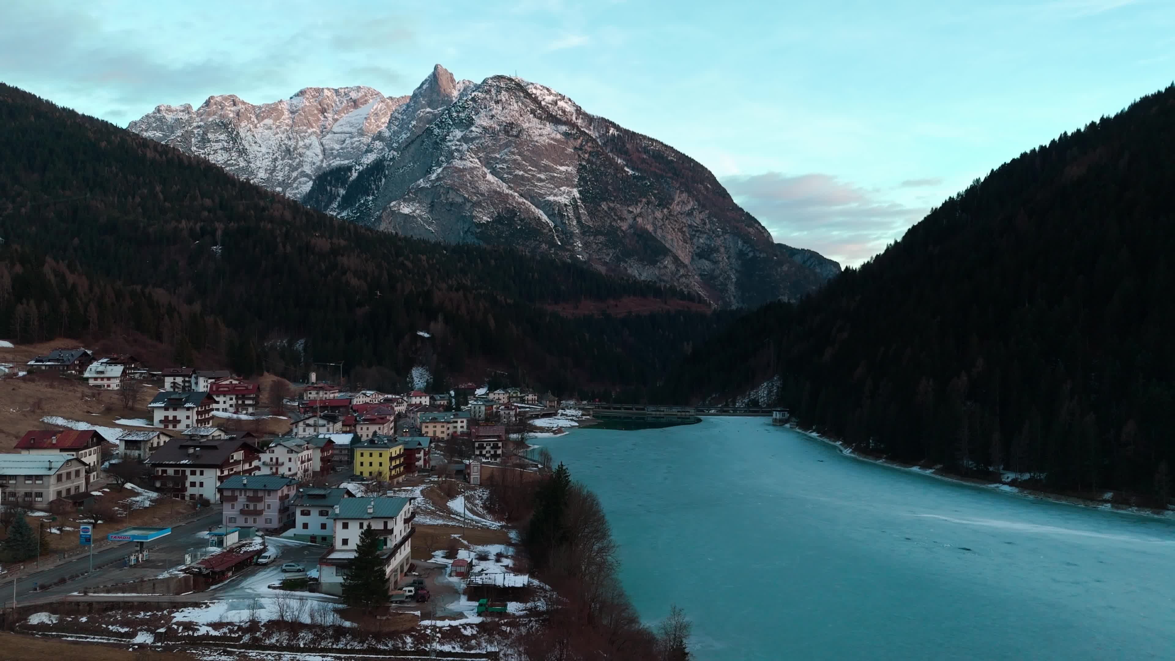 Drone View Of Santa Caterina Lake (Auronzo Lake) At Sunset With Frozen Water
