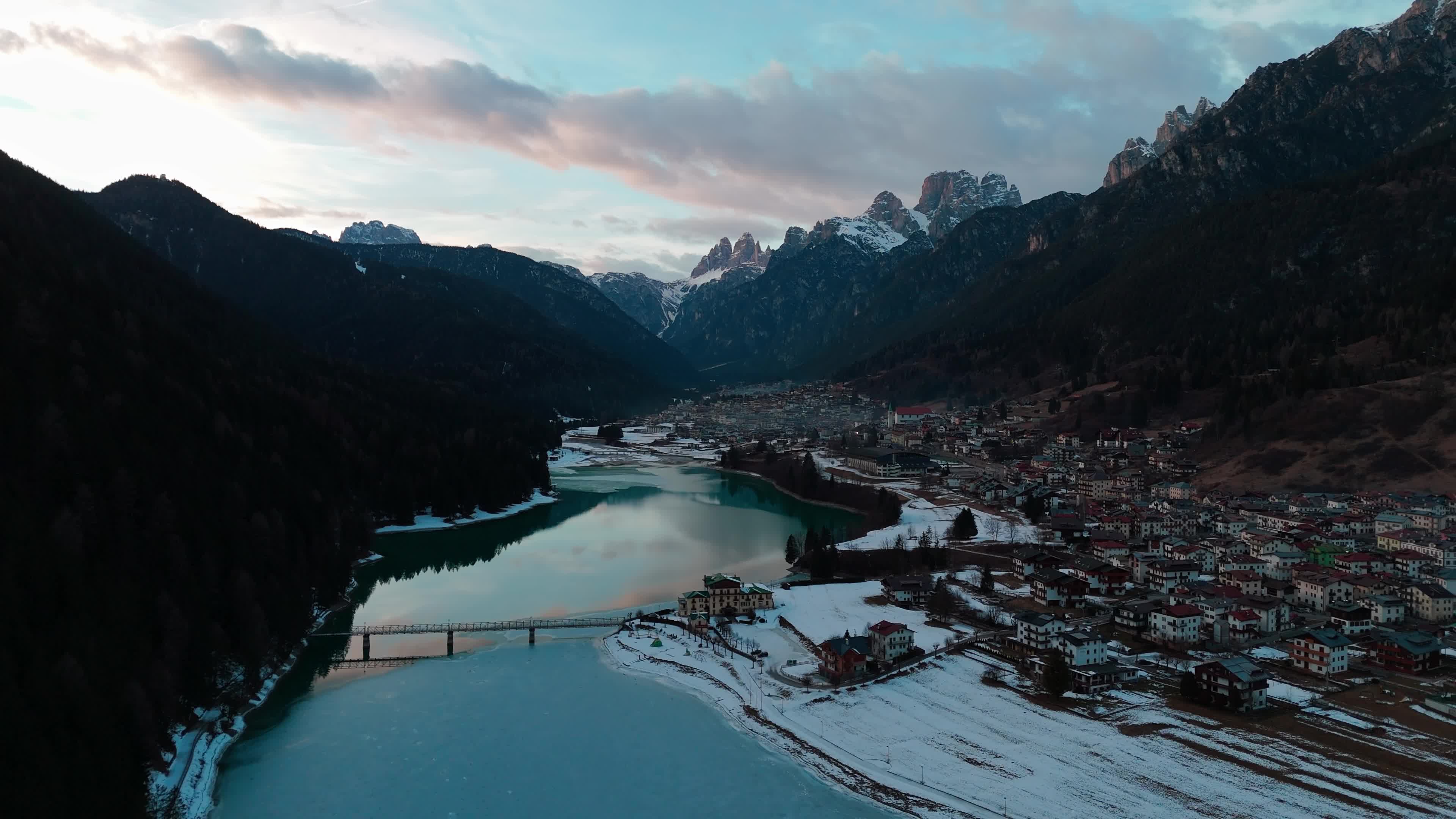 Drone View Of Santa Caterina Lake (Auronzo Lake) At Sunset With Frozen Water