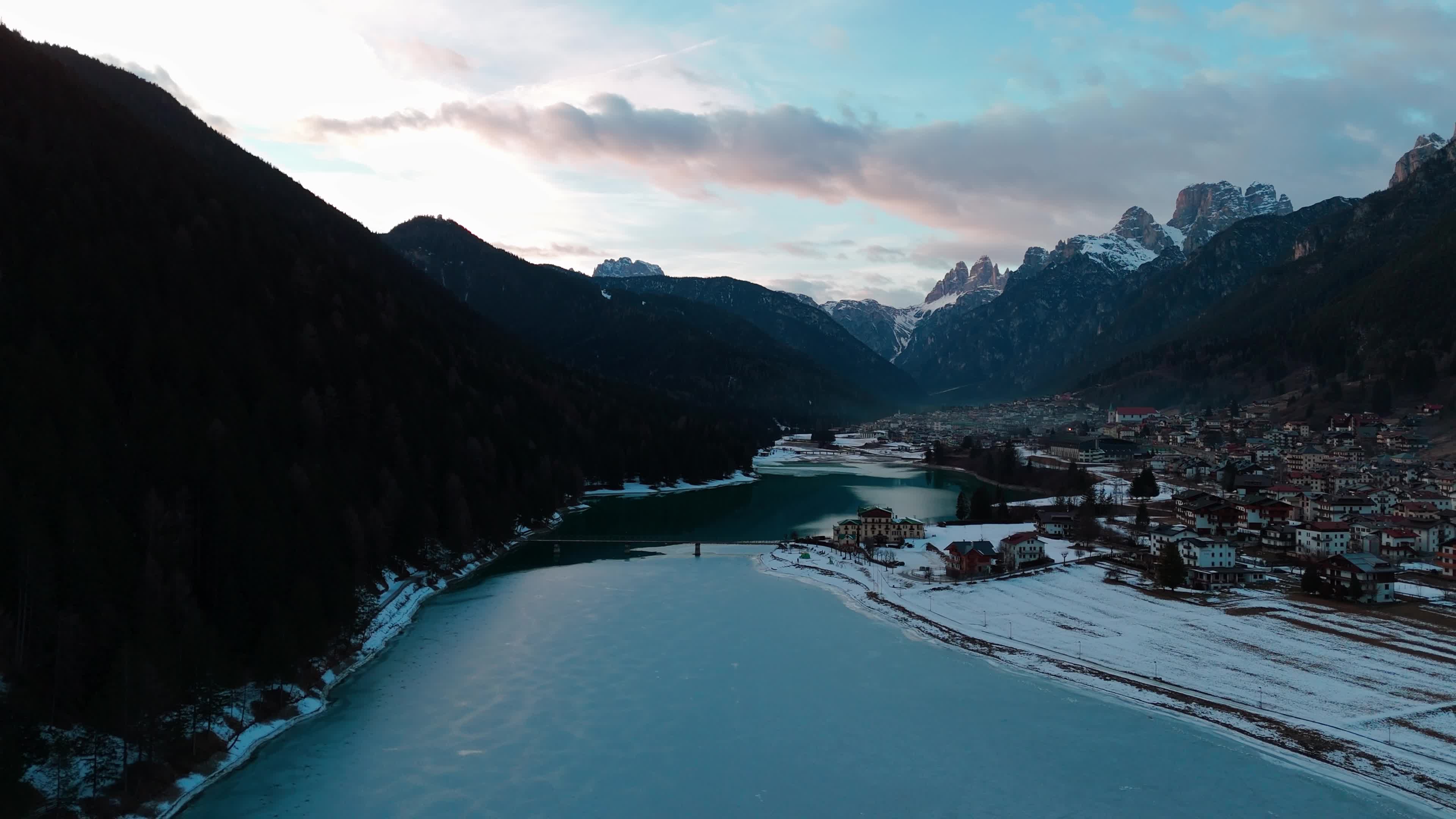 Drone View Of Santa Caterina Lake (Auronzo Lake) At Sunset With Frozen Water
