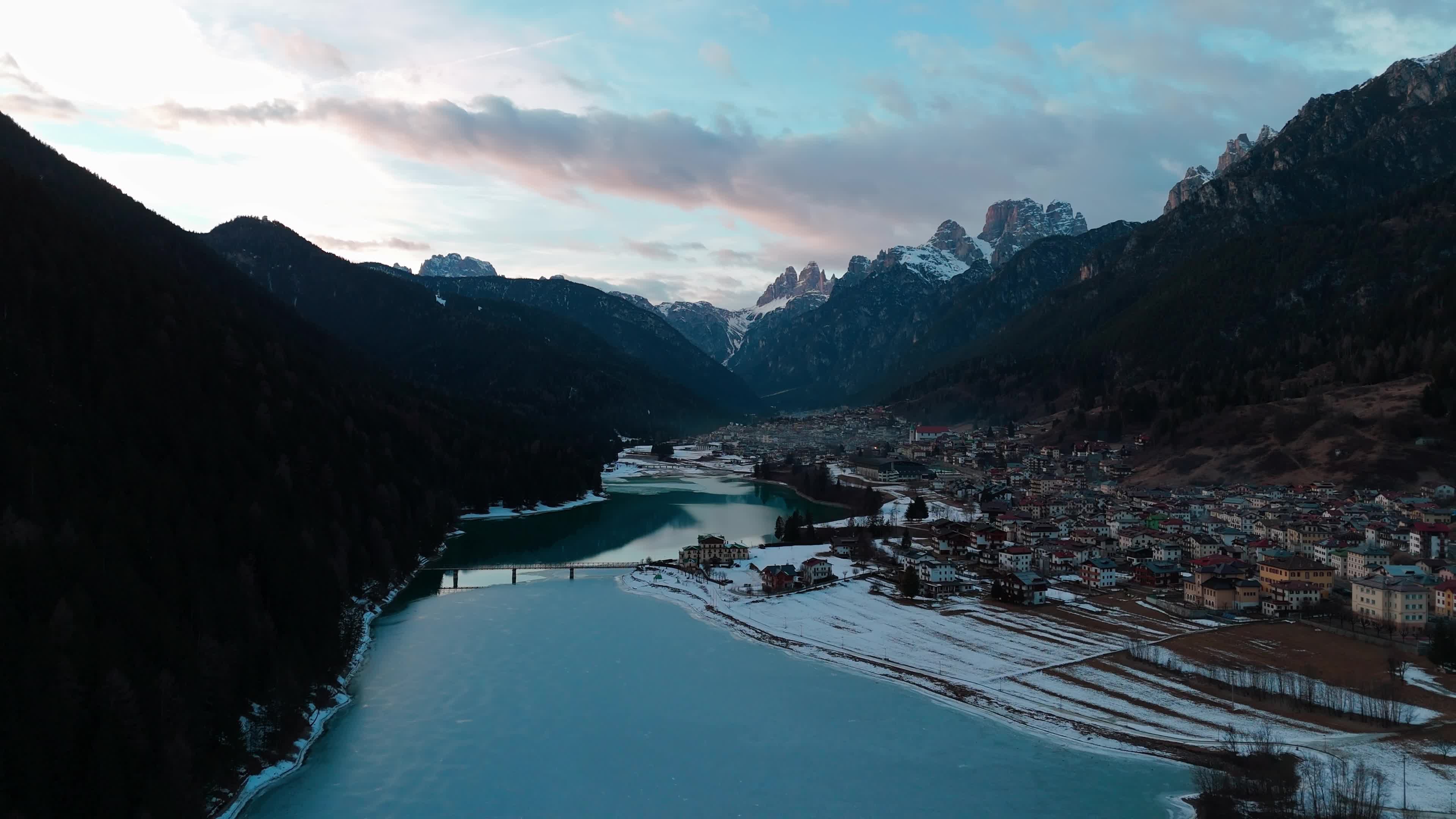 Drone View Of Santa Caterina Lake (Auronzo Lake) At Sunset With Frozen Water