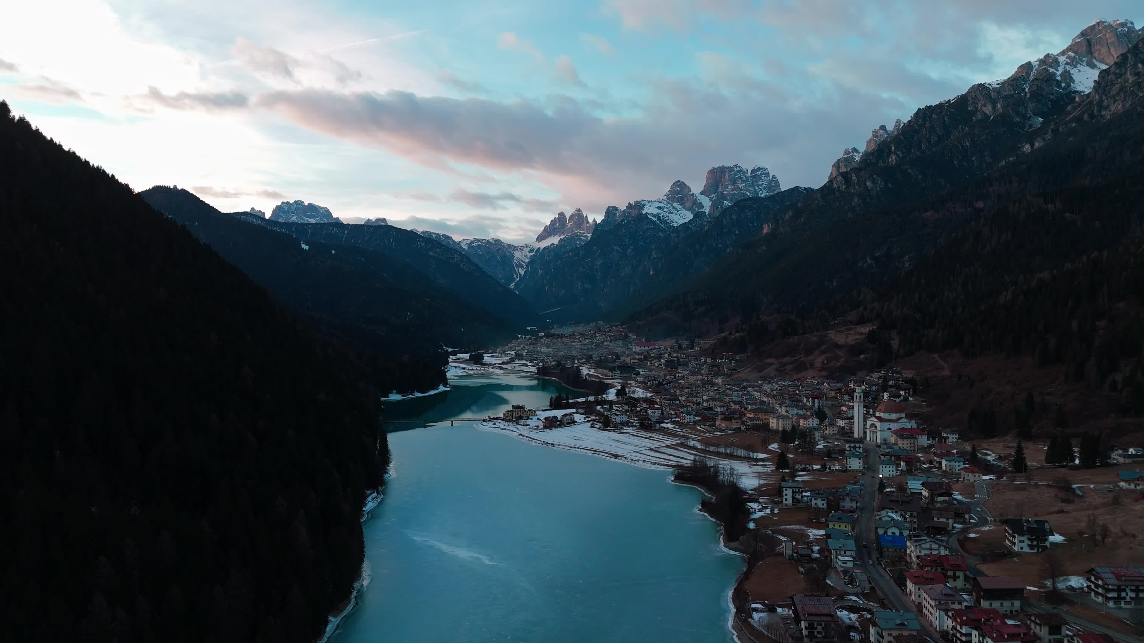 Drone View Of Santa Caterina Lake (Auronzo Lake) At Sunset With Frozen Water