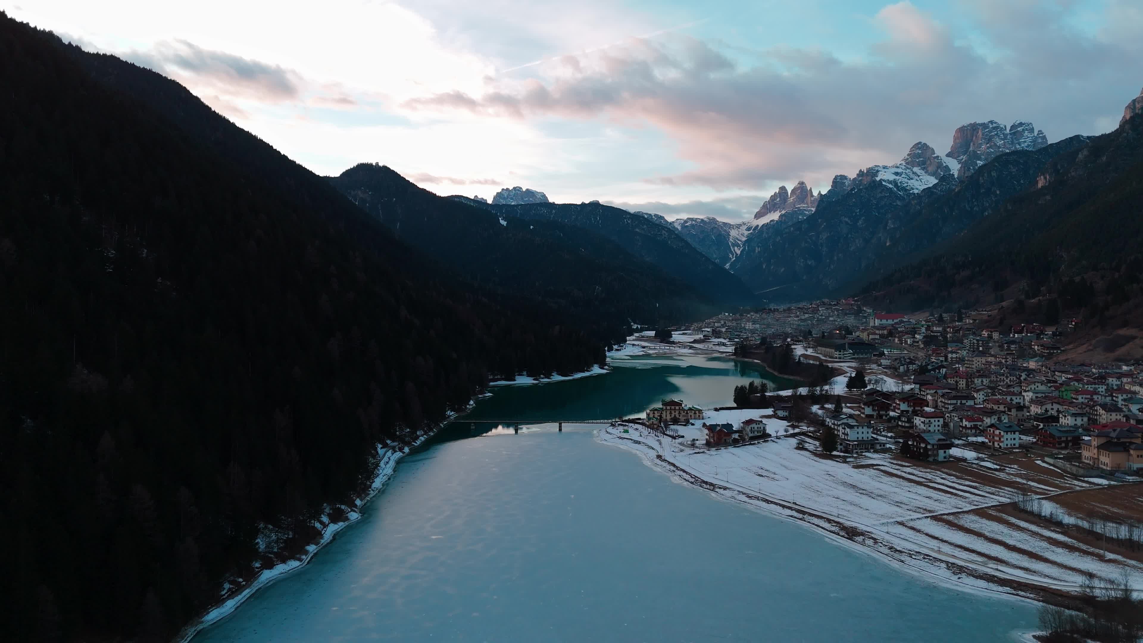 Drone View Of Santa Caterina Lake (Auronzo Lake) At Sunset With Frozen Water
