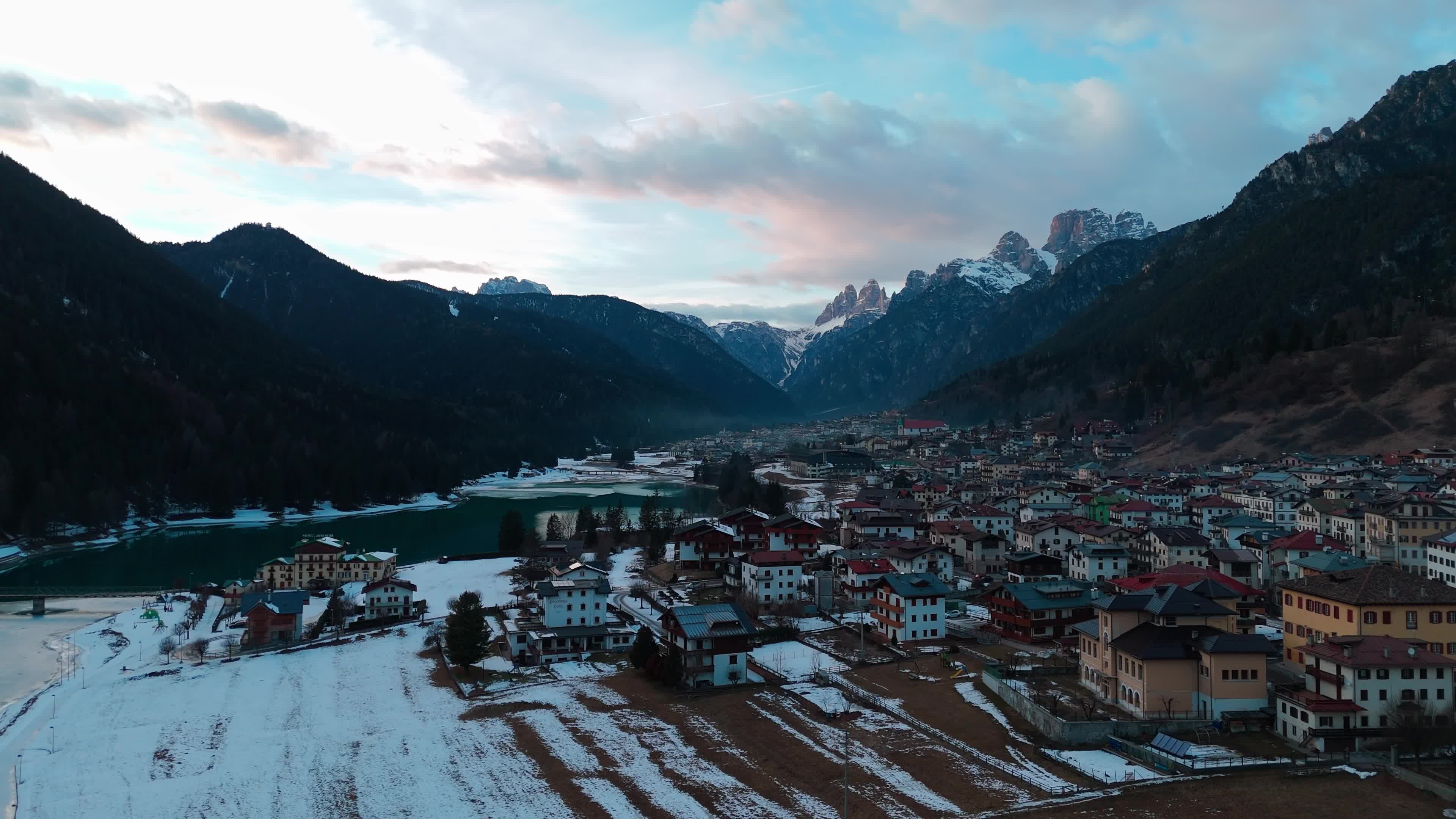 Drone View Of Santa Caterina Lake (Auronzo Lake) At Sunset With Frozen Water