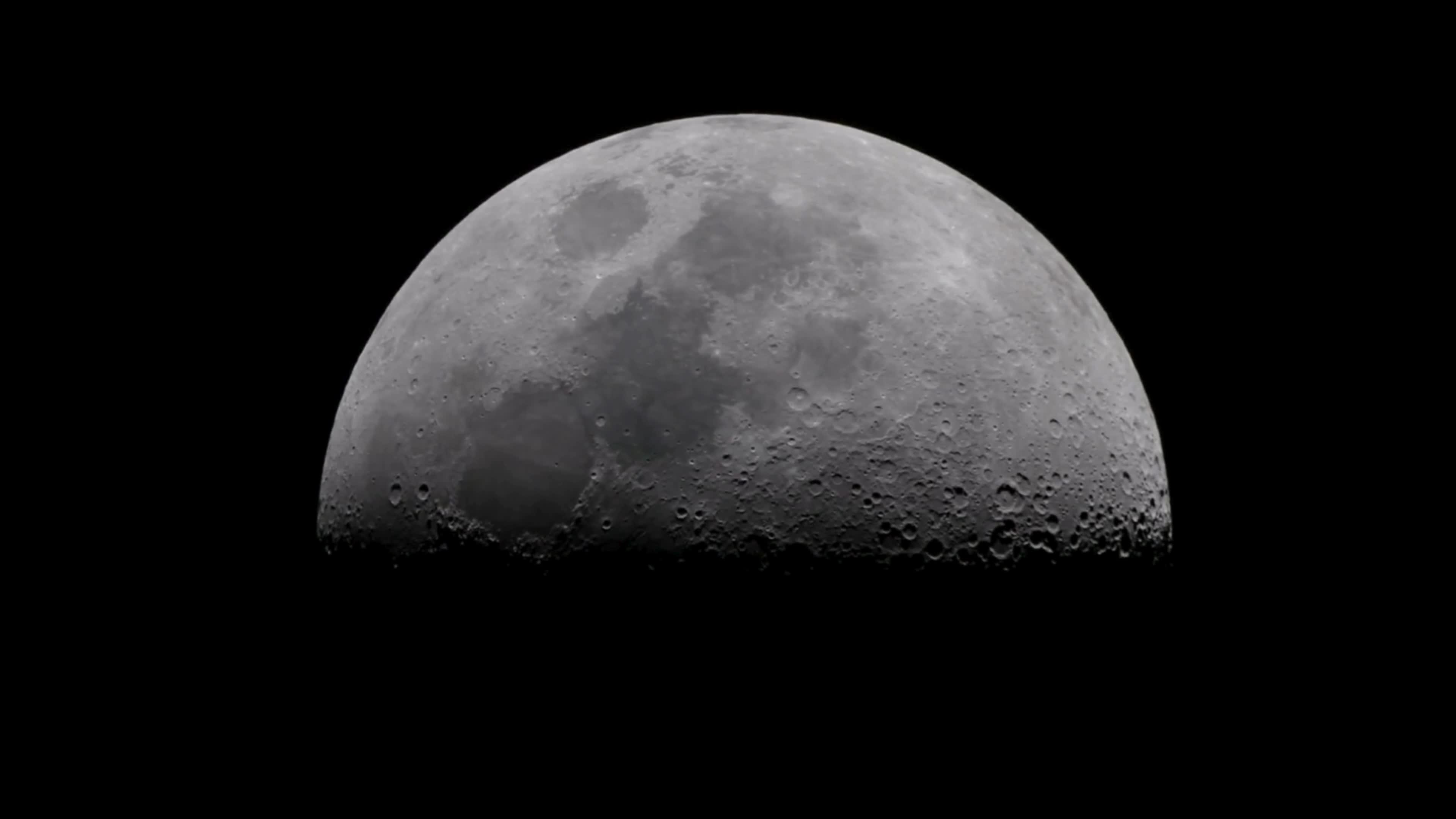 Moon In First Quarter Through A Telescope