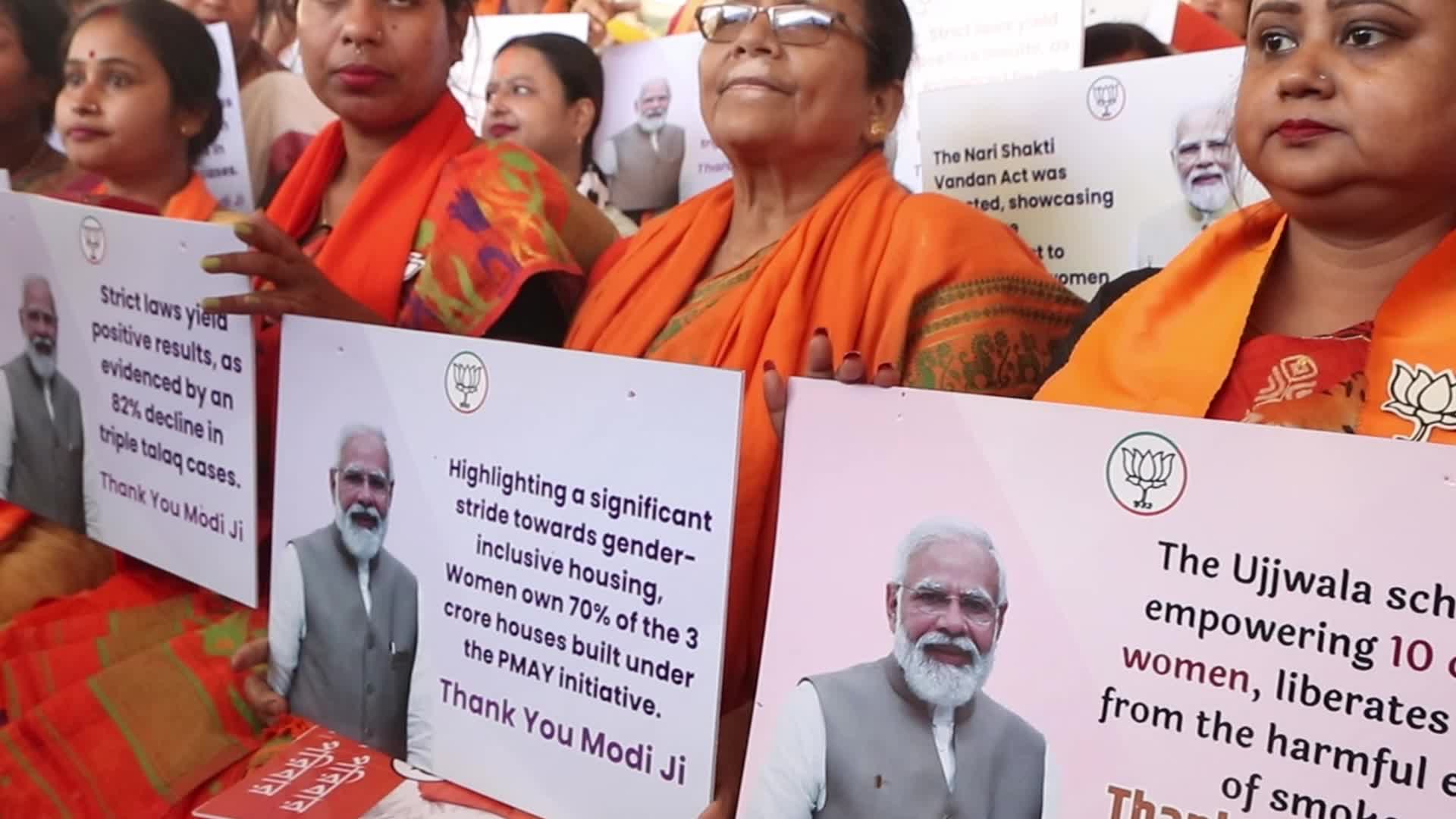 BJP Supporter Holds Narendra Modi Cutout at Public Meeting in Barasat, Kolkata