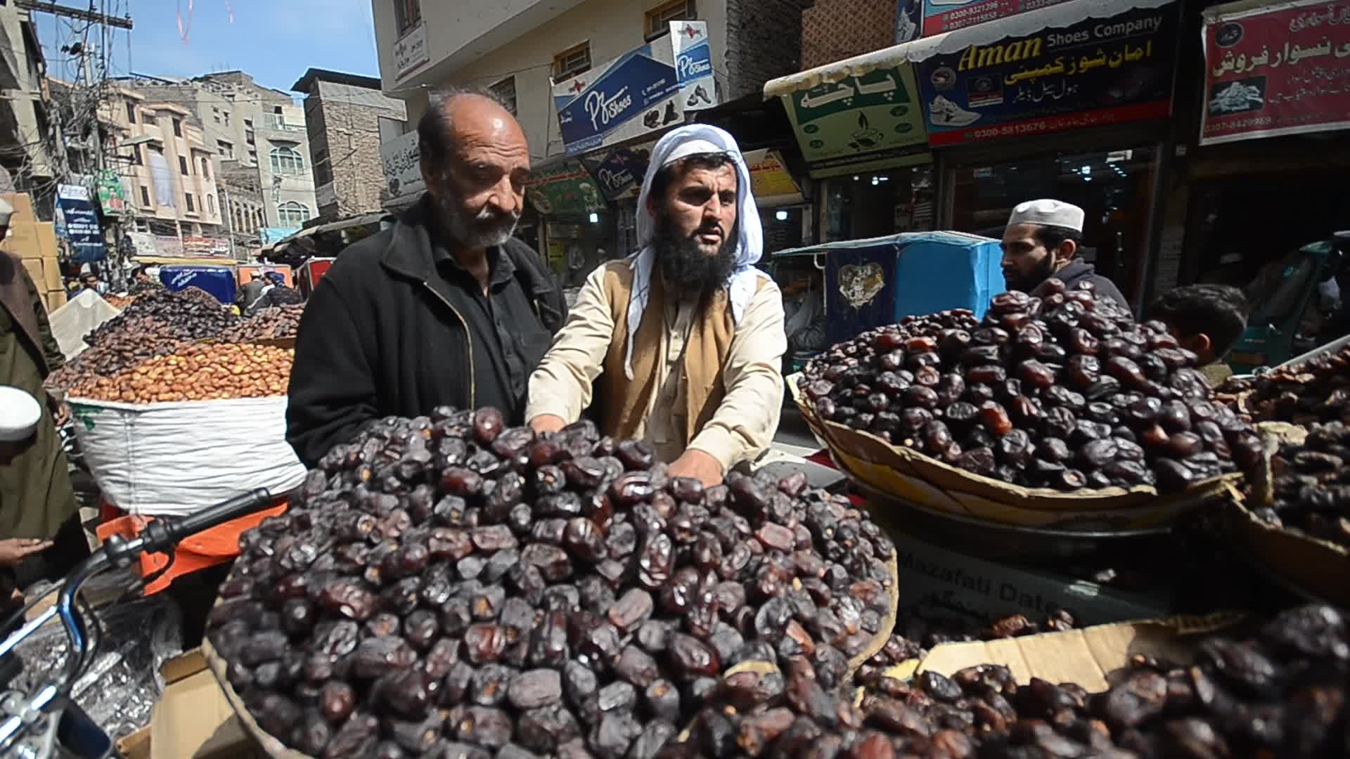 People shop ahead of Muslims' holy month of Ramdan in Pakistan