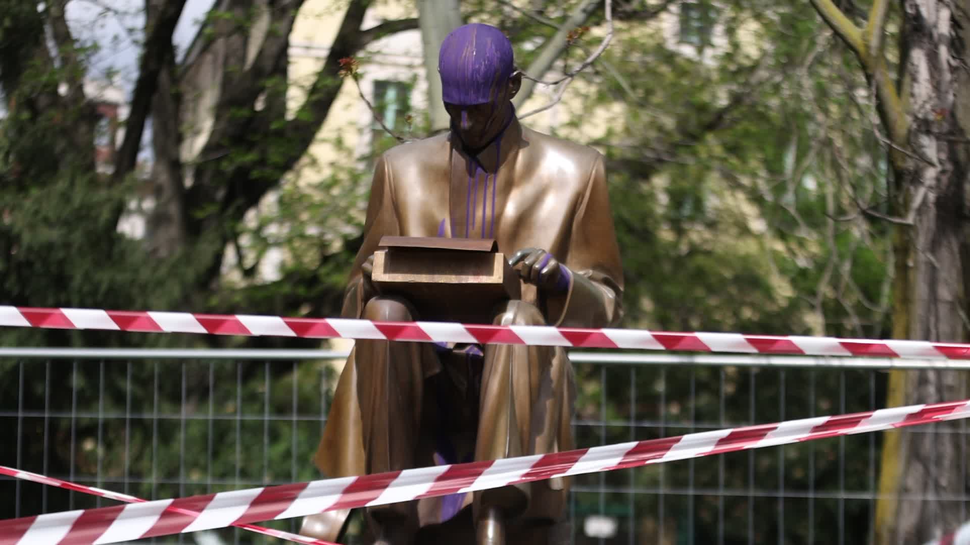 The Indro Montanelli statue vandalized with purple paint in the Indro Montanelli Gardens in Milan