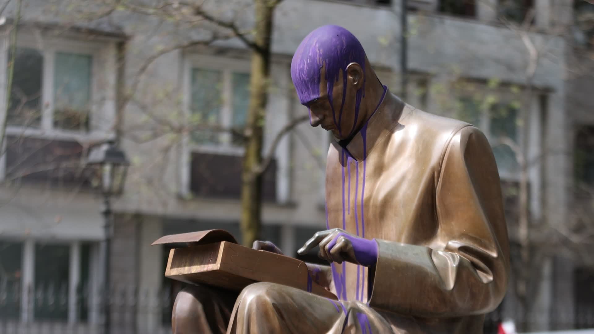 The Indro Montanelli statue vandalized with purple paint in the Indro Montanelli Gardens in Milan