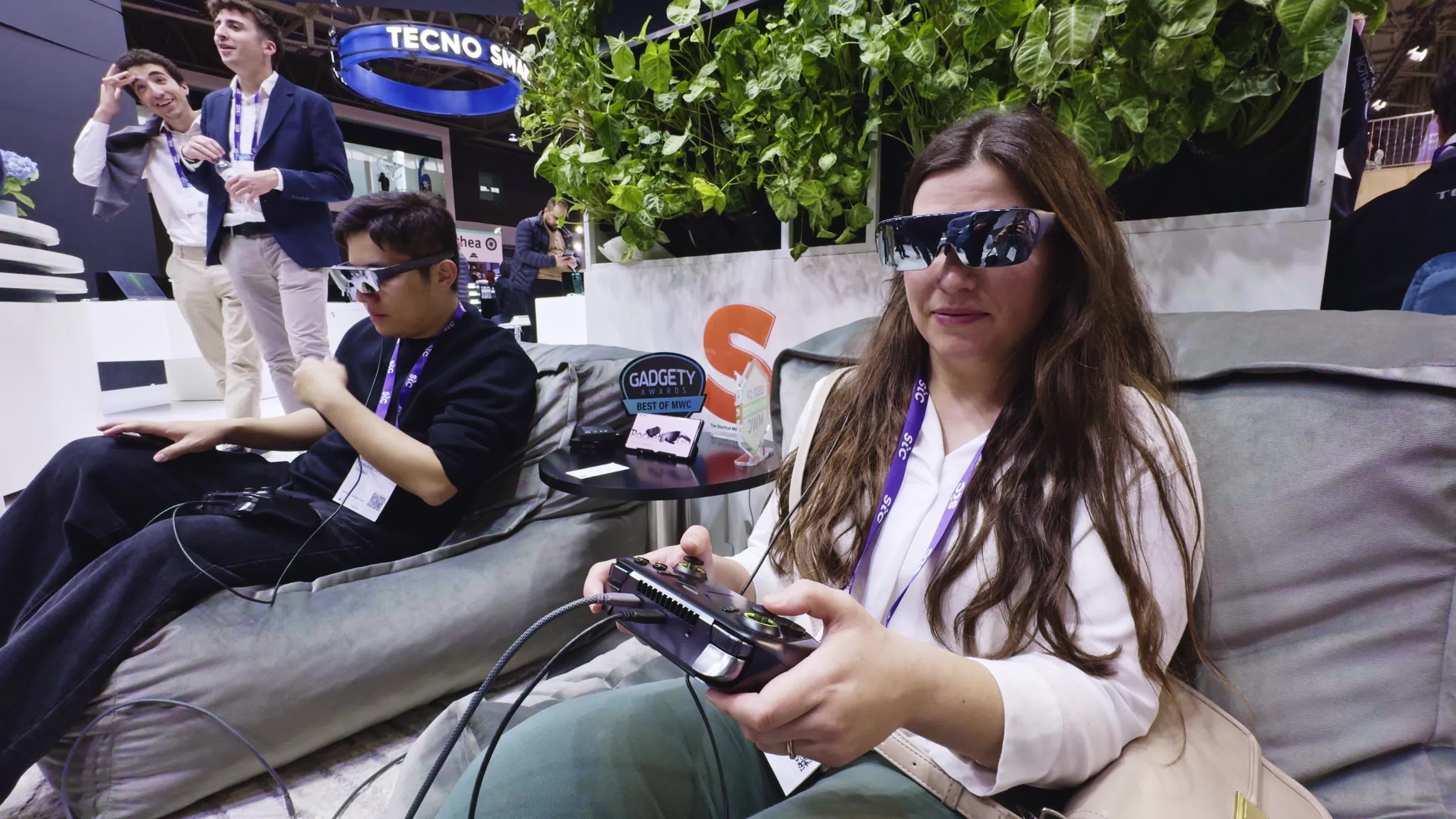 A woman playing video games on the Tecno Pocket Go