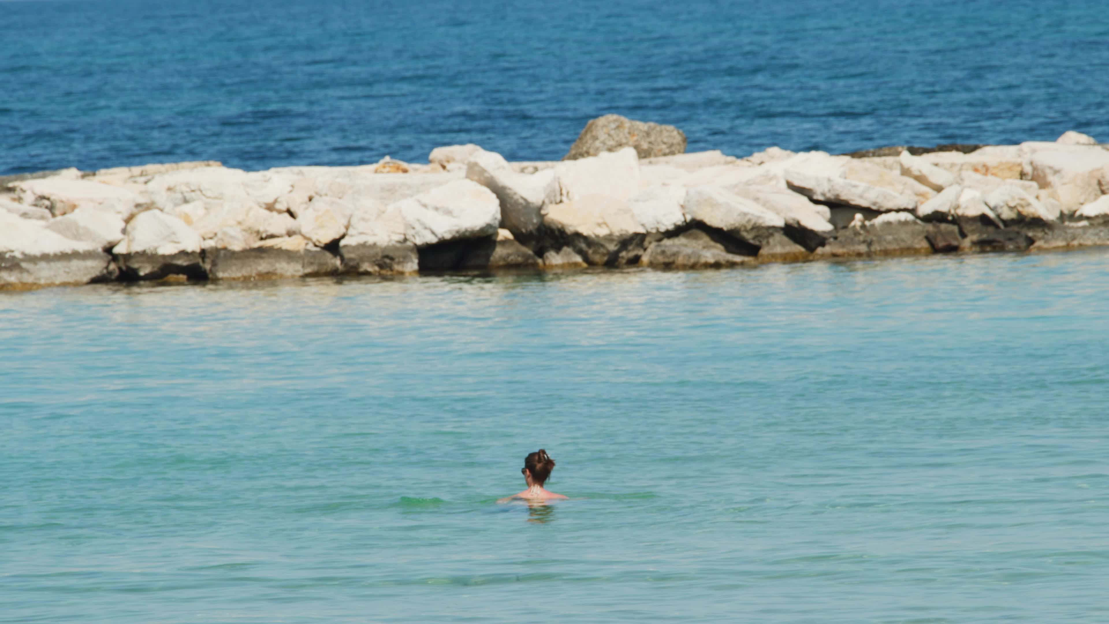 People at the Beach in Italy Amid Above-Normal Temperatures in April