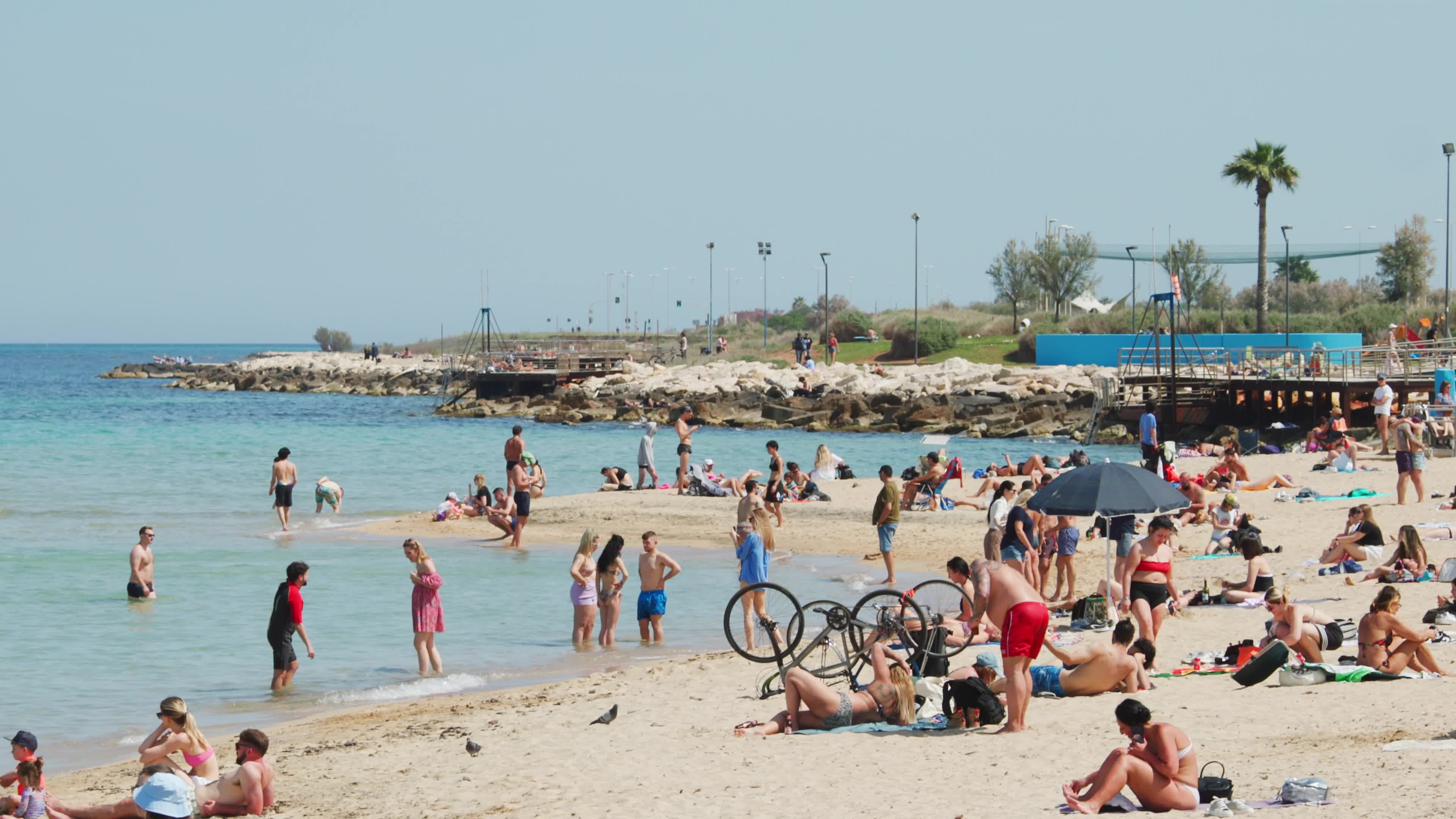 People at the Beach in Italy Amid Above-Normal Temperatures in April