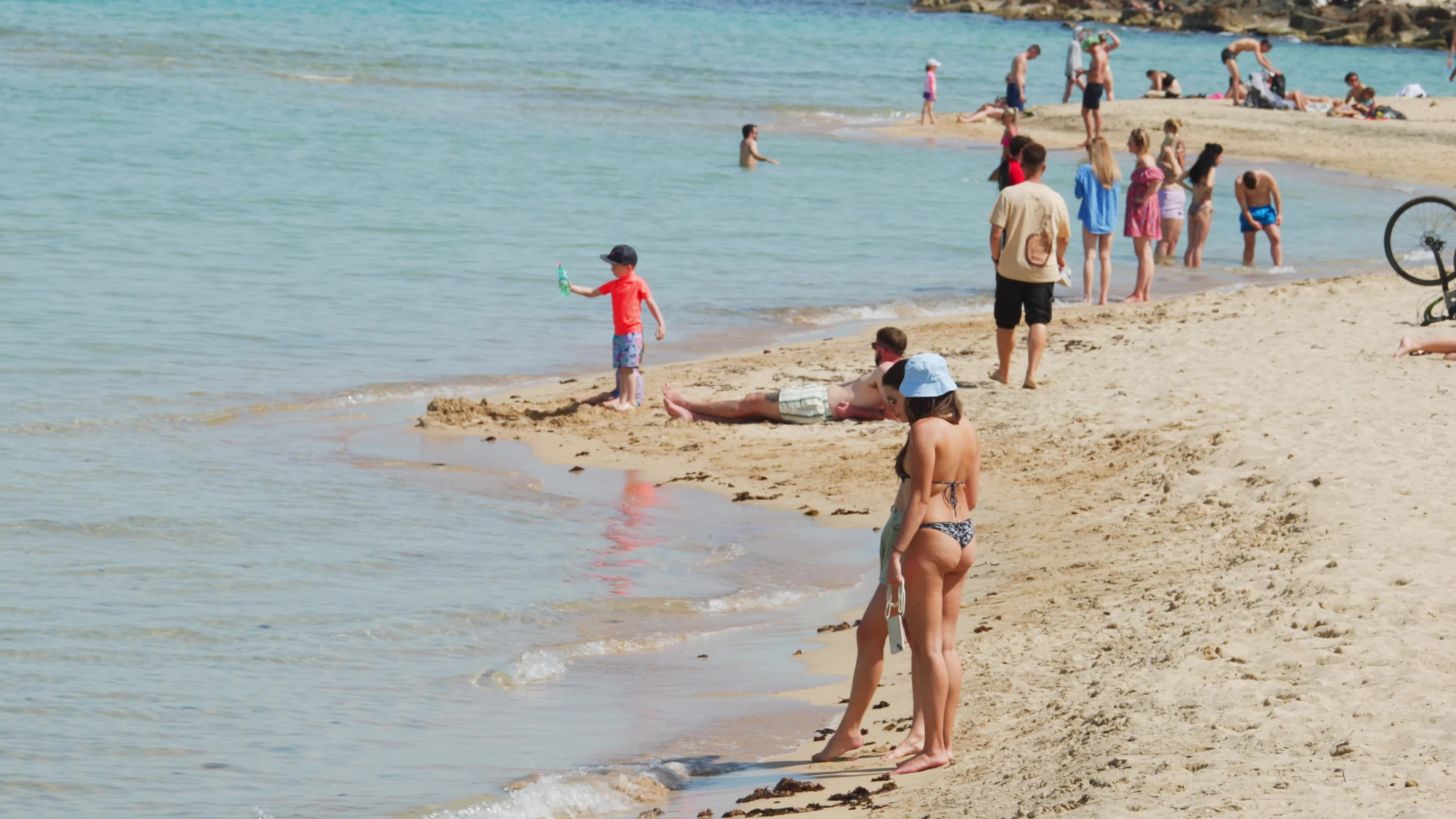 People at the Beach in Italy Amid Above-Normal Temperatures in April
